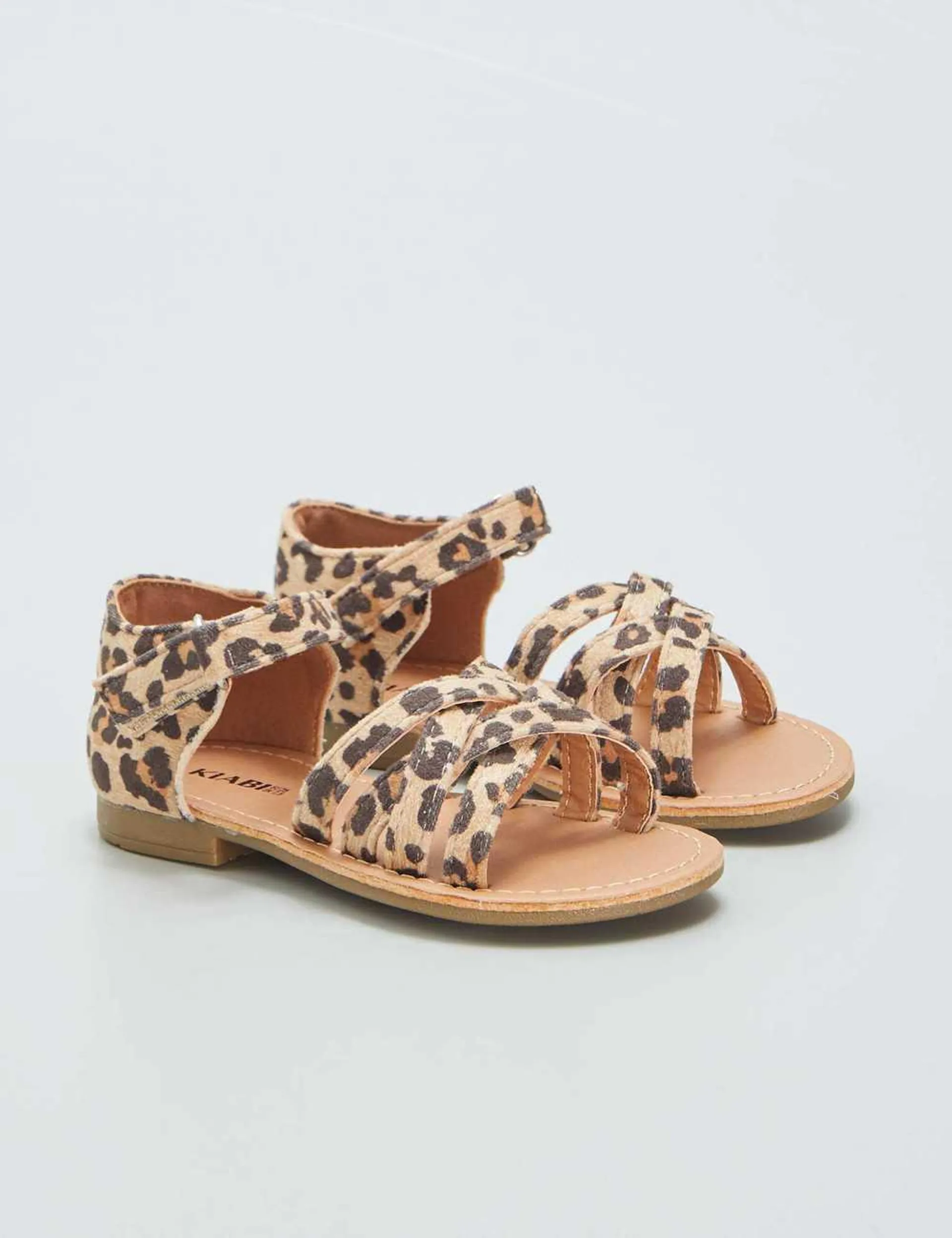 Sandals with leopard print crossover straps