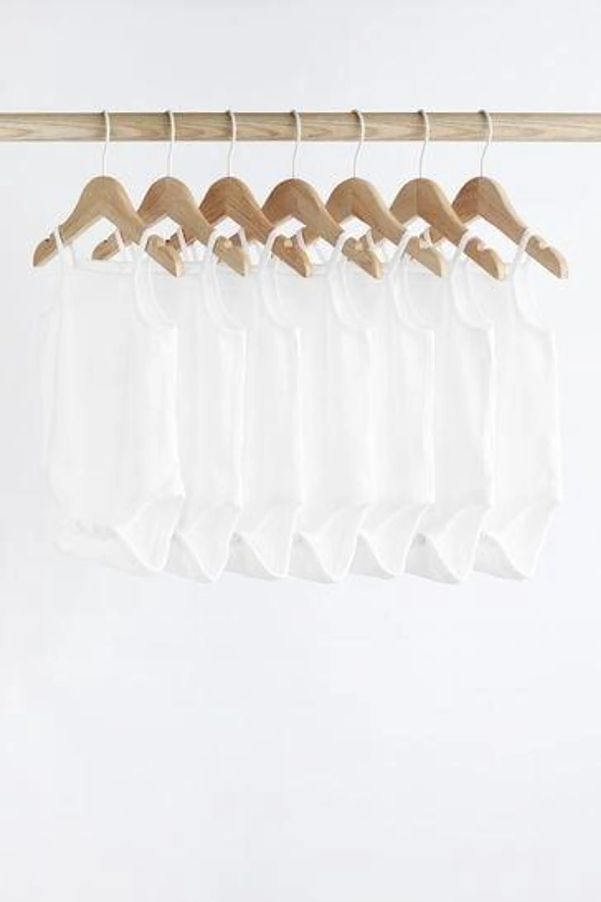 White Strappy Baby Bodysuits