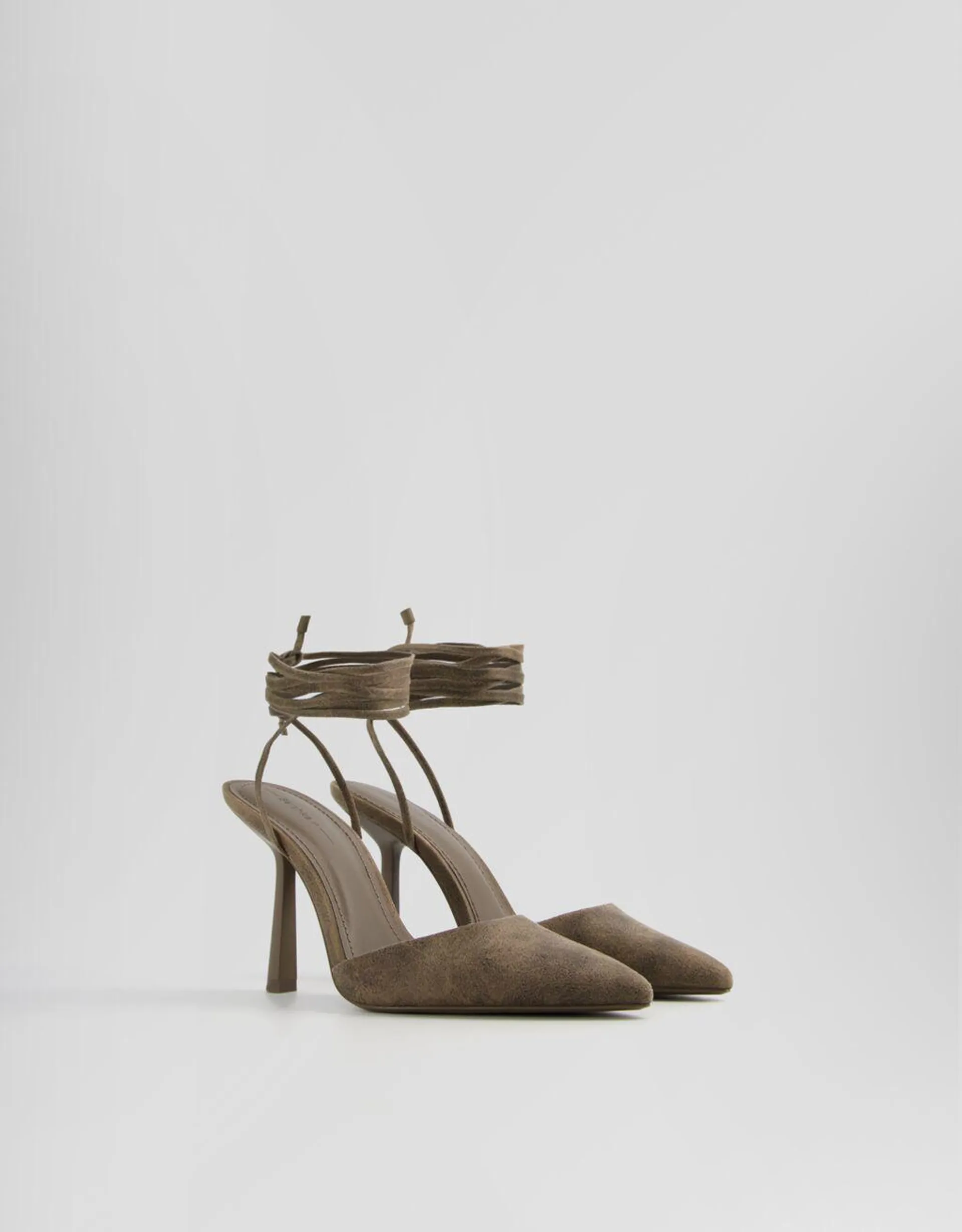 Tied high heel slingback shoes