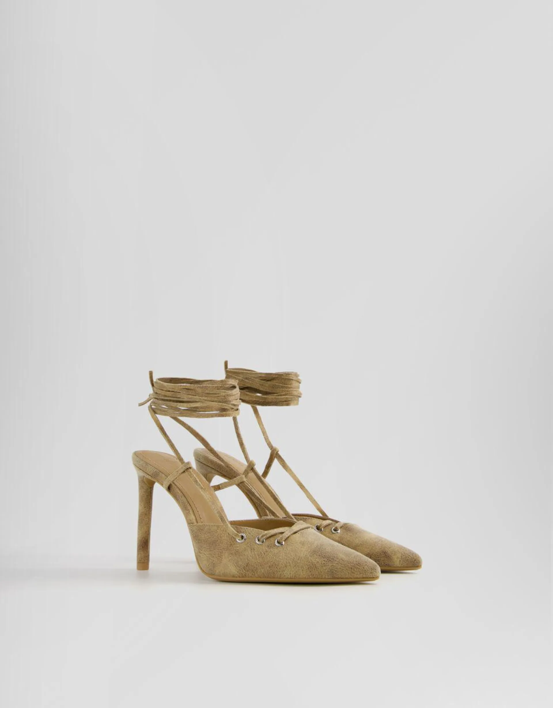 Tied high heel slingback shoes