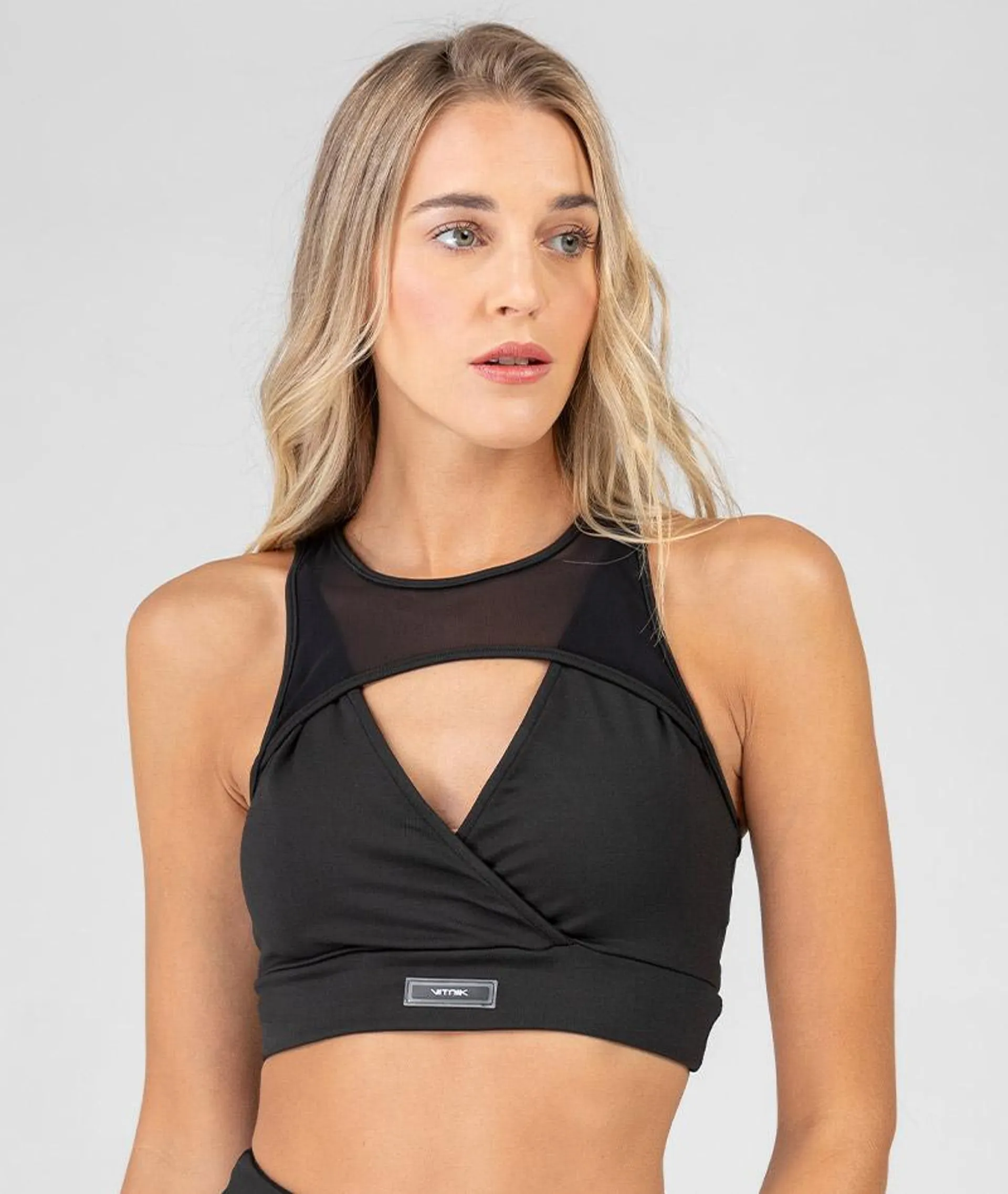 Top AIR-FIT escote cruzado con detalle de microtul al tono