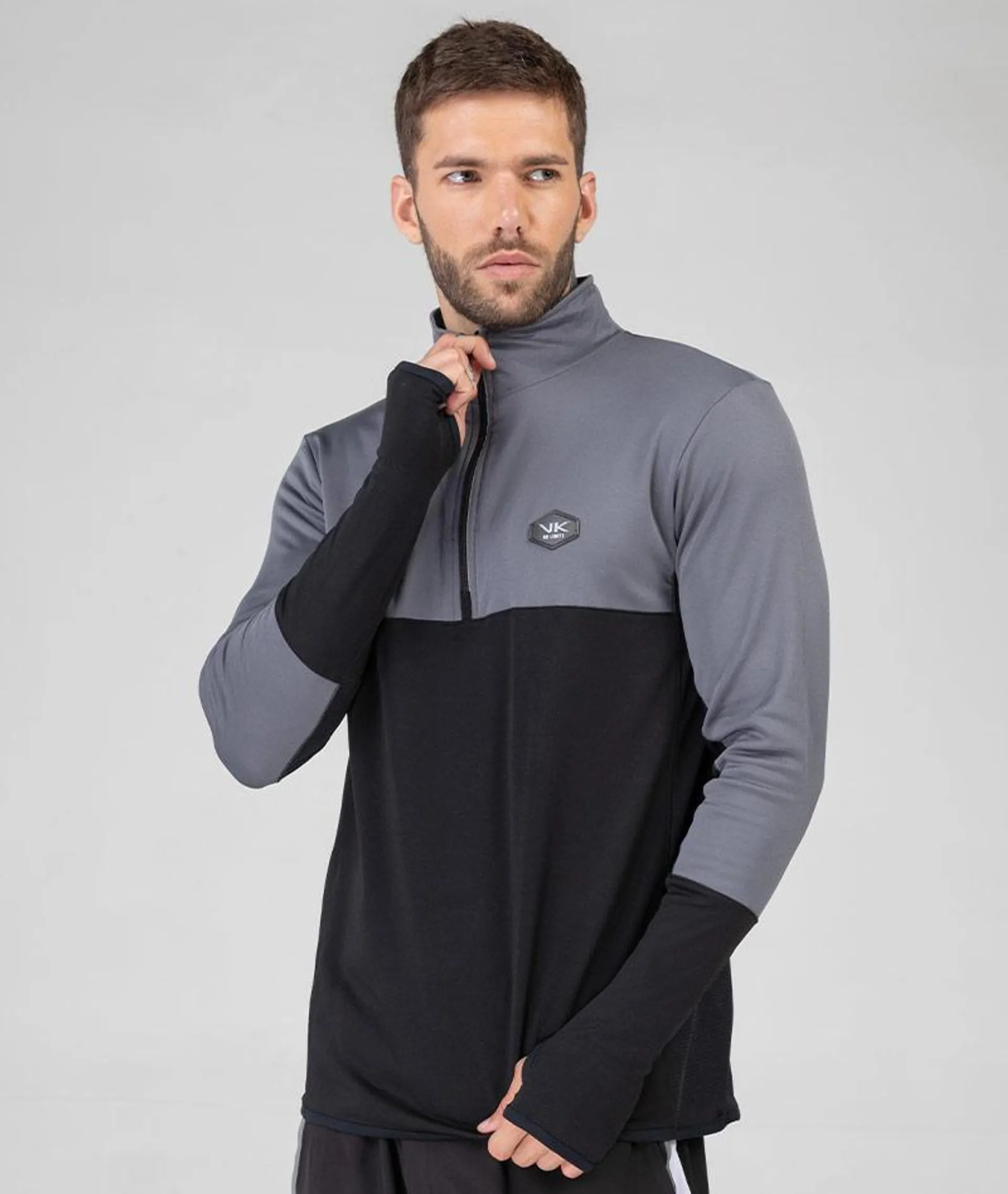 Polera T.DRY warm combinada con reflex en cierre y puños runner