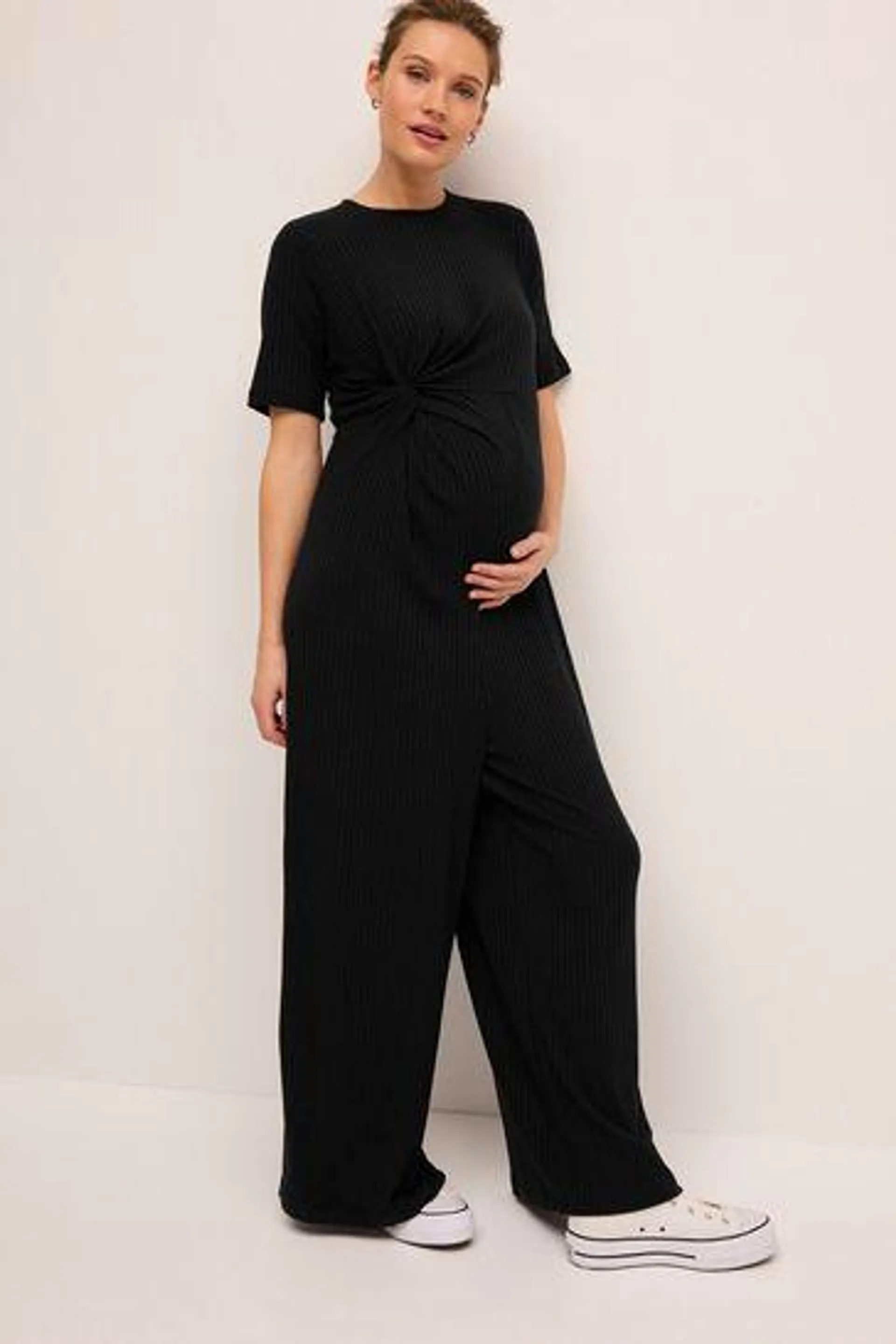 Schwarz - Gerippter Jumpsuit mit seitlichem Knotendesign