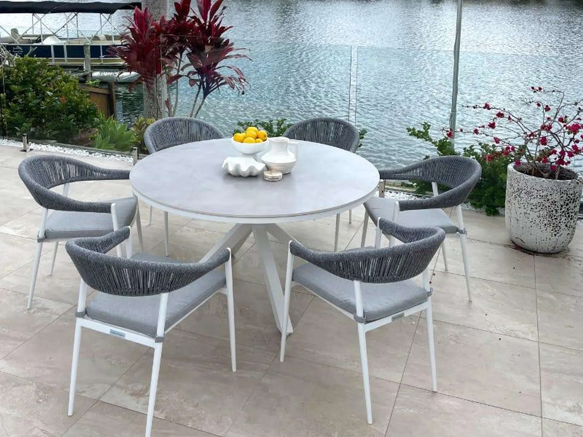Adele Round Ceramic Table with Nivala Chairs 7pc Outdoor Dining Setting