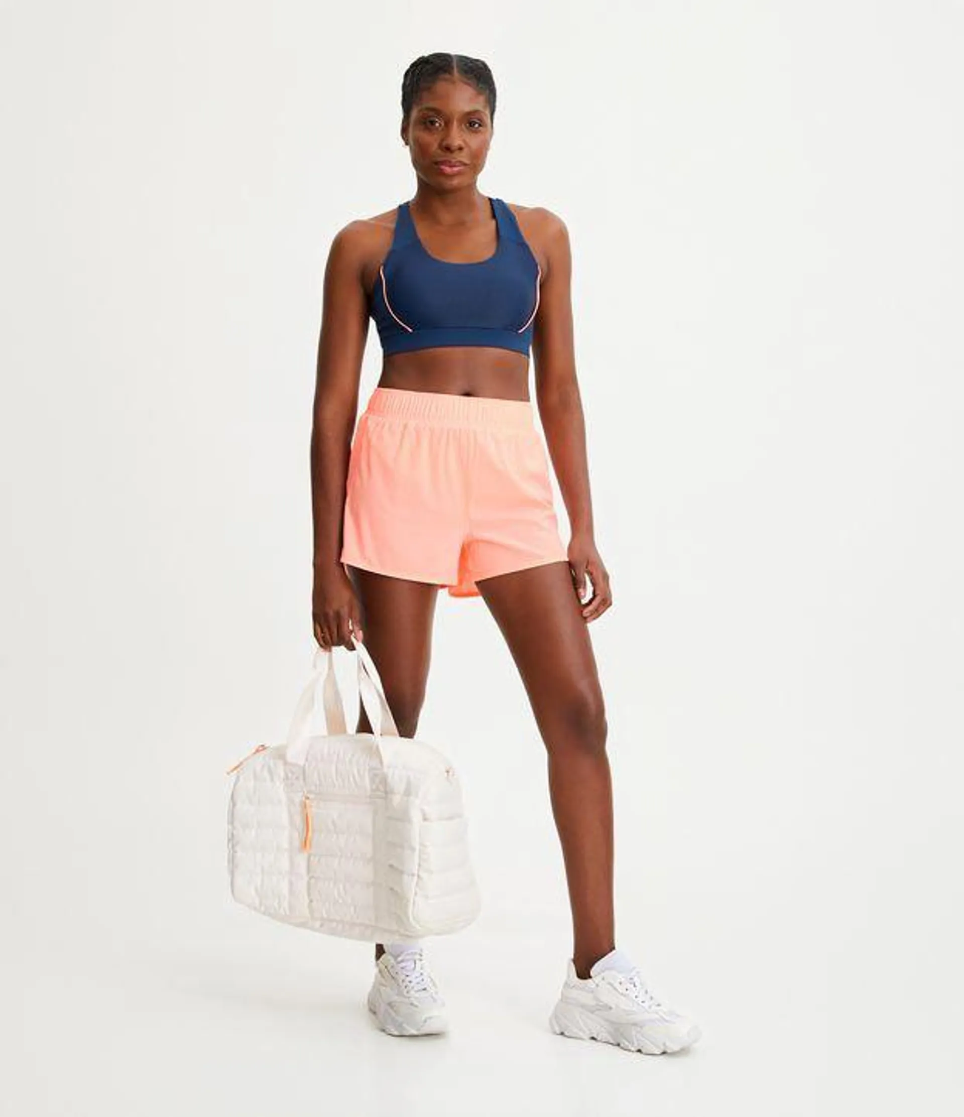 Short Runner Esportivo com Elástico no Cós e Bolso Interno Laranja Claro