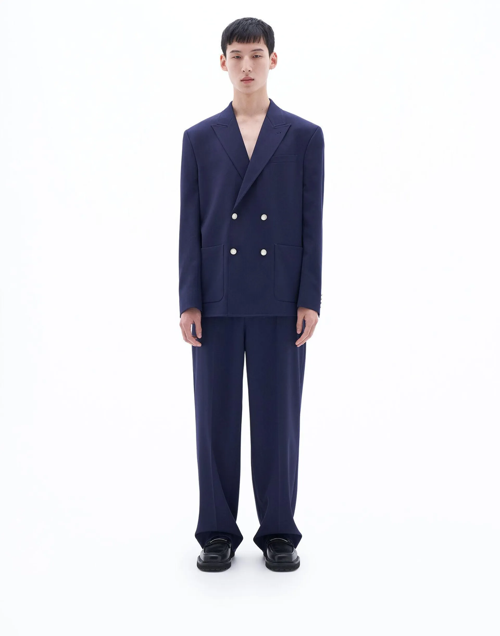 Double breasted blazer in stretch twill with gold buttoning.