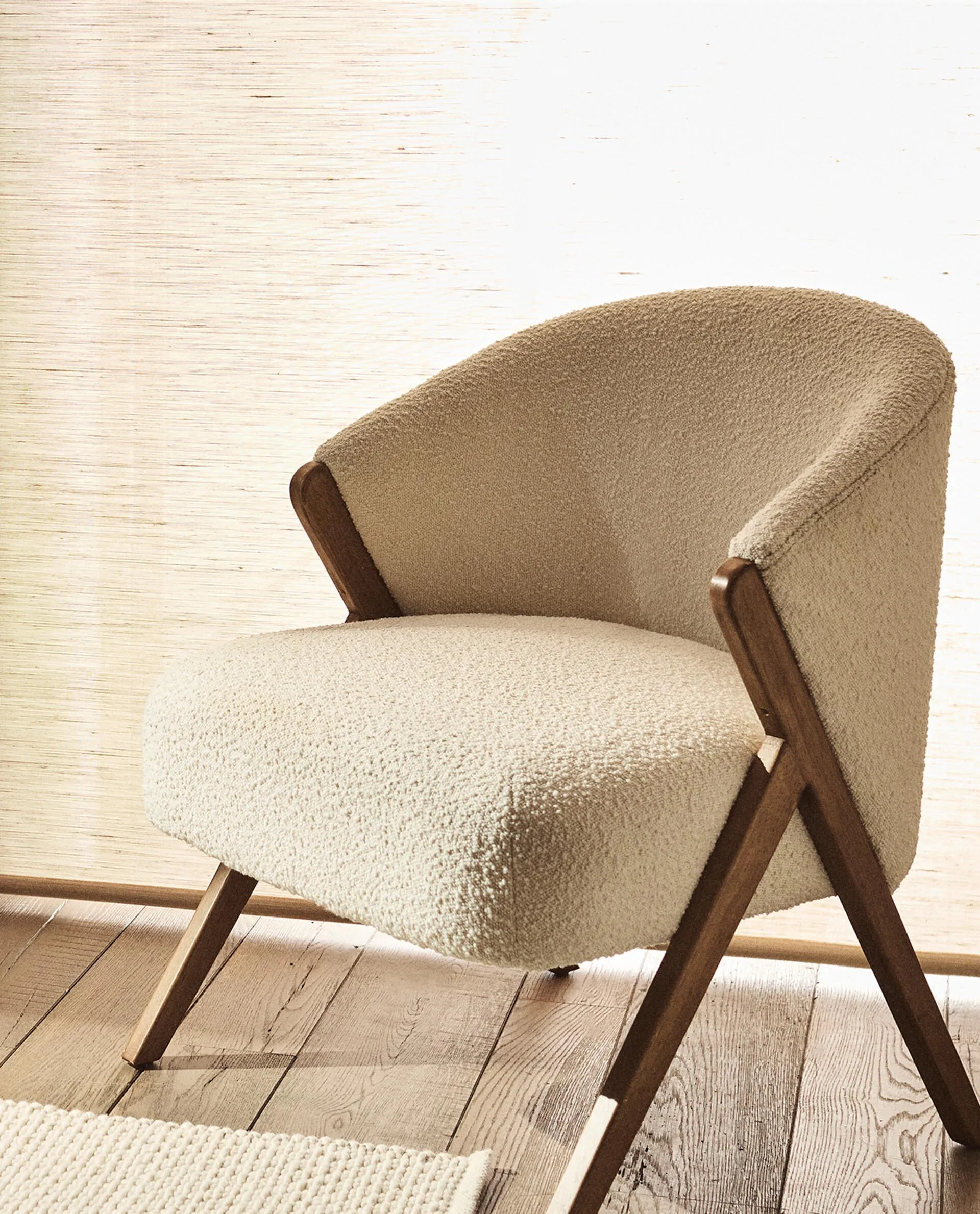 UPHOLSTERED BOUCLÉ ARMCHAIR