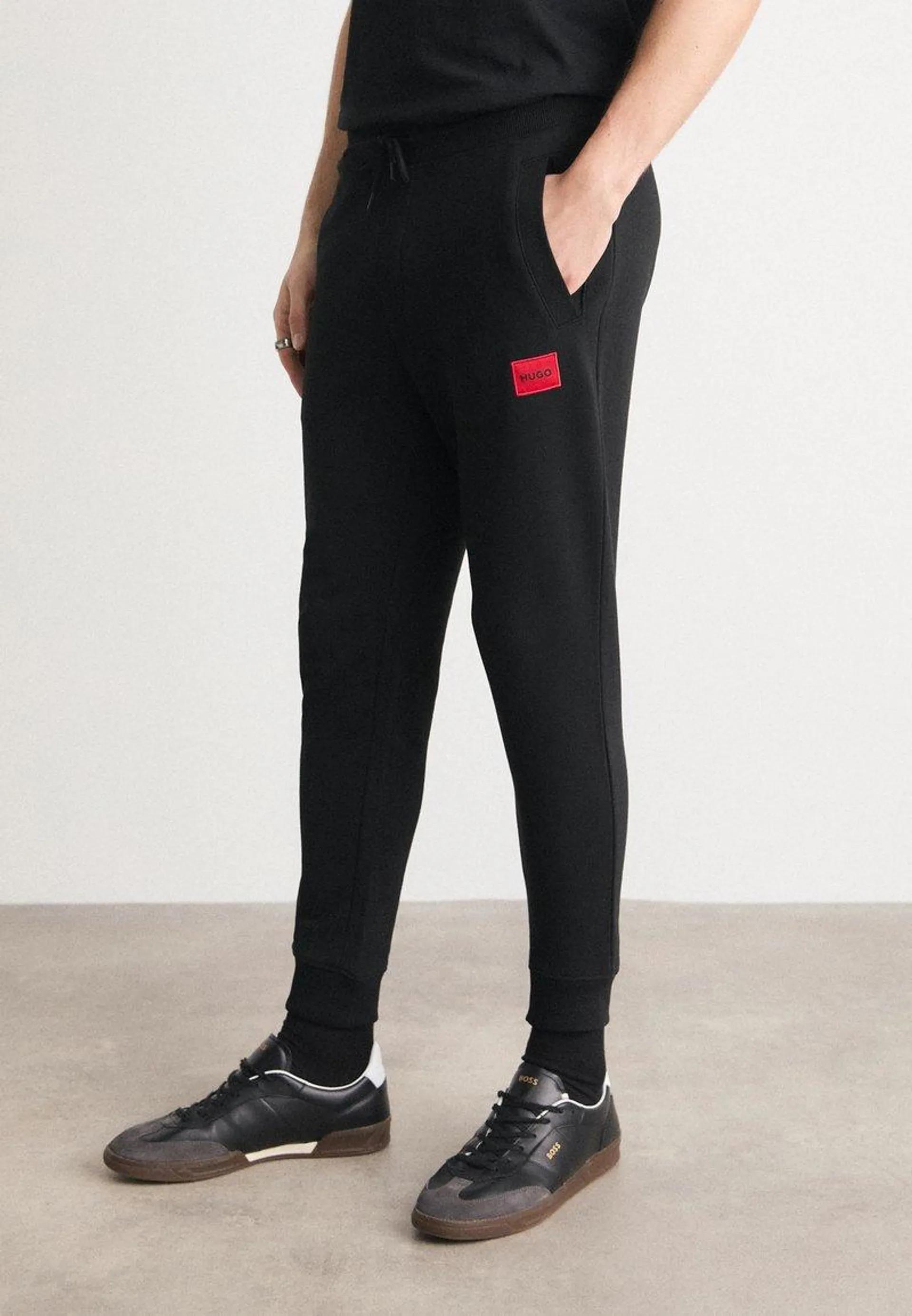 DOAK - Tracksuit bottoms - black