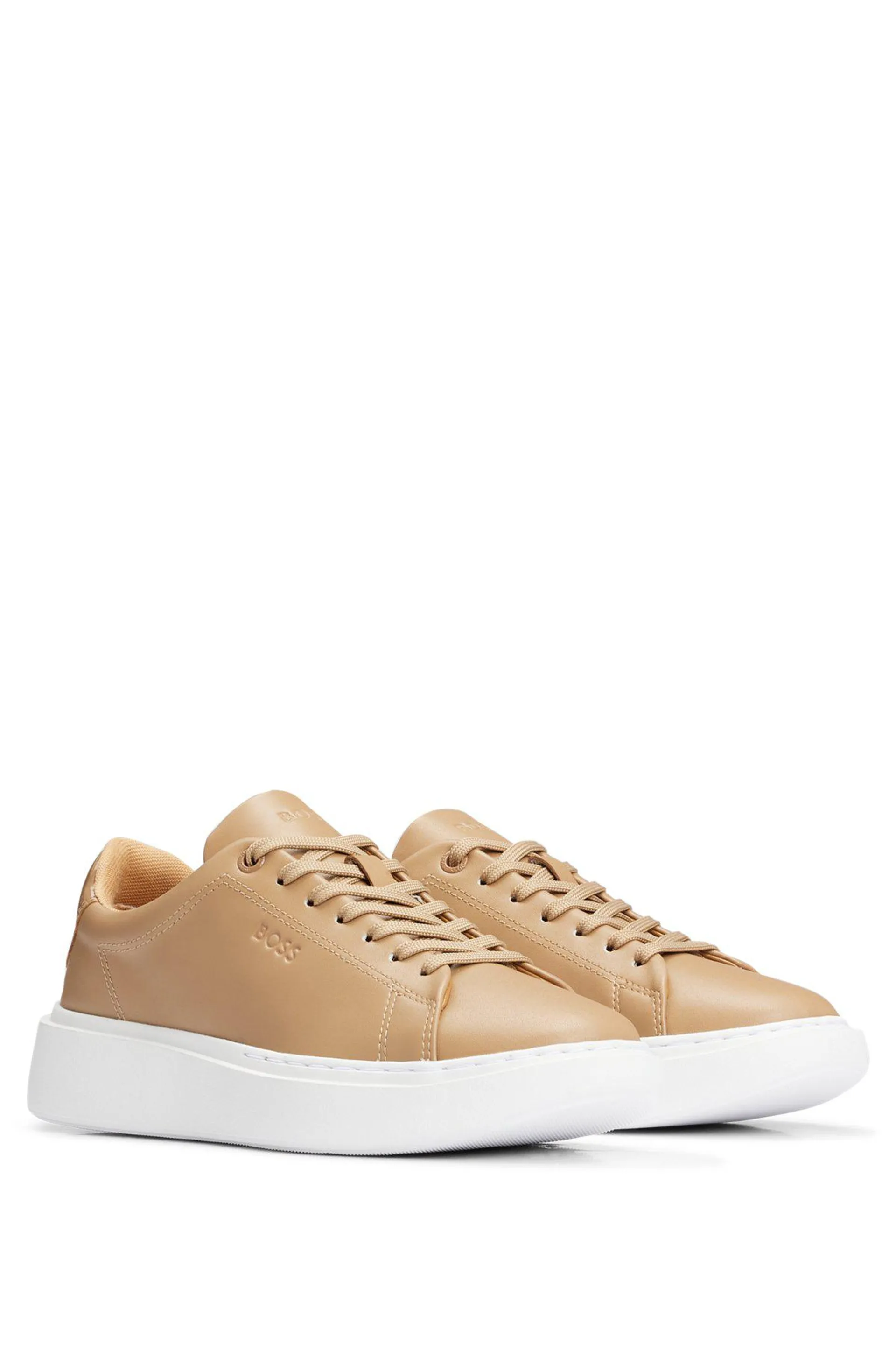 Deportivas tipo cupsole con logo grabado y talón brillante