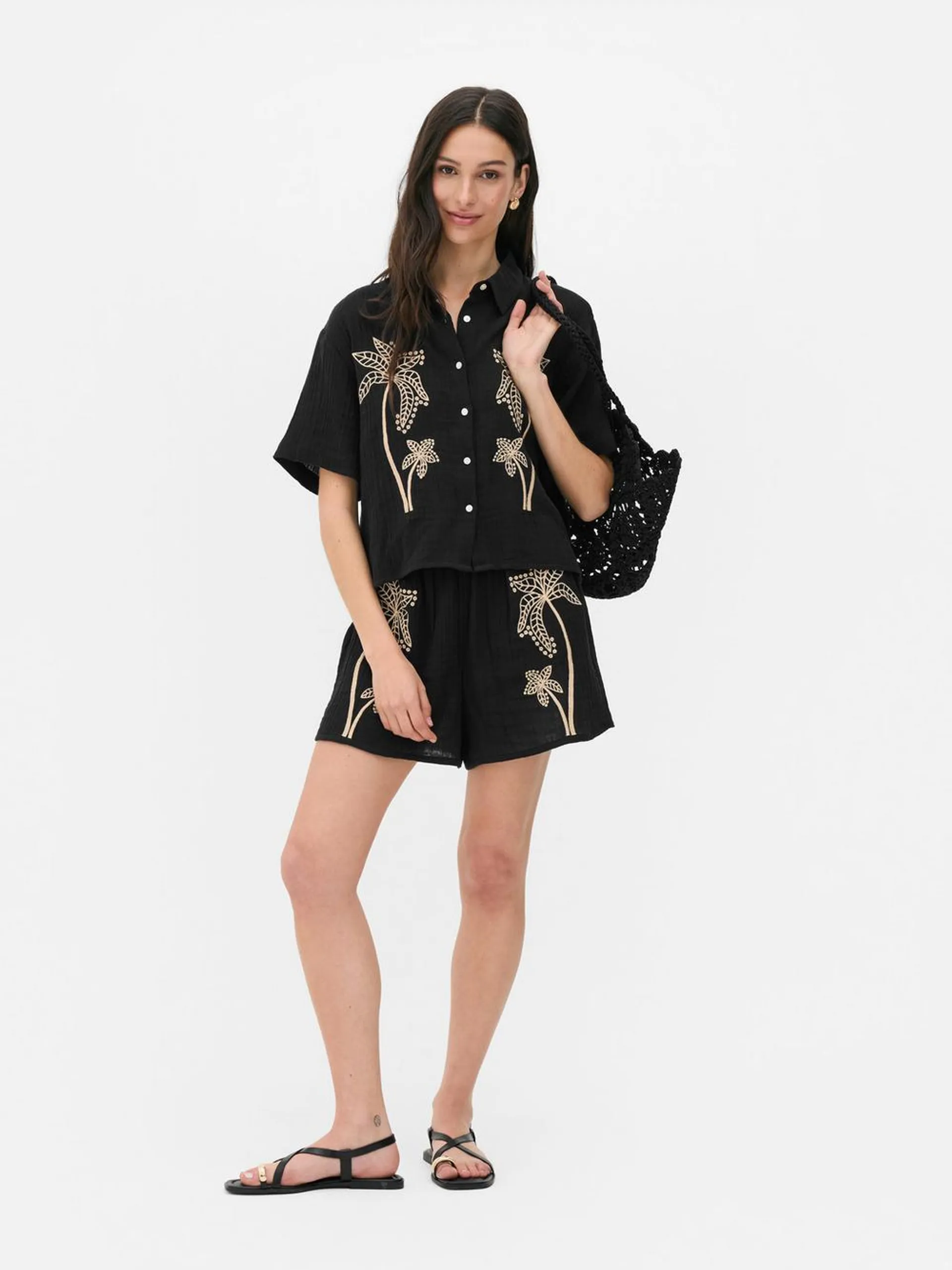 Camisa playera con palmeras