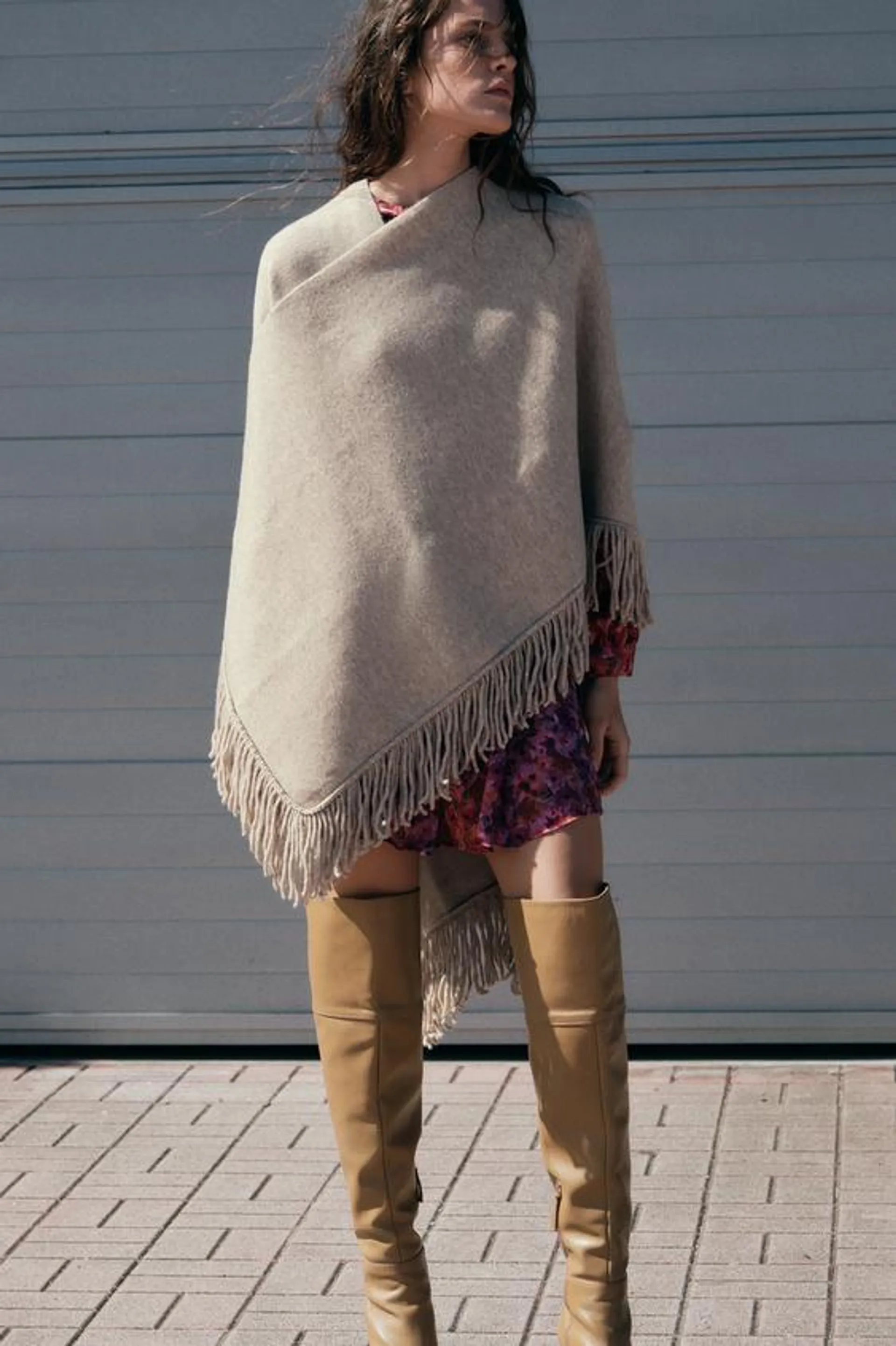 FRINGED KNIT CAPE