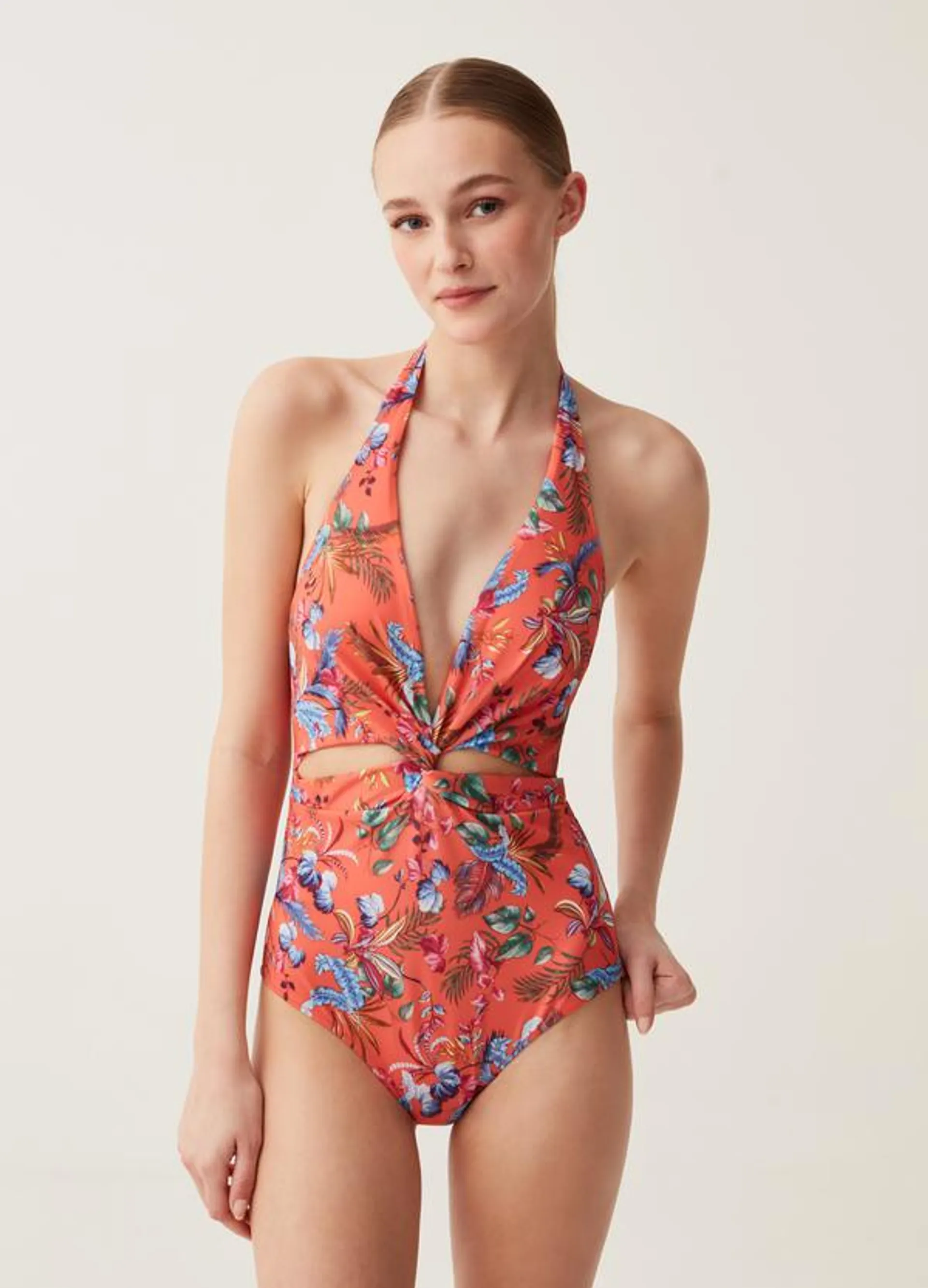 One-piece swimsuit with tropical print