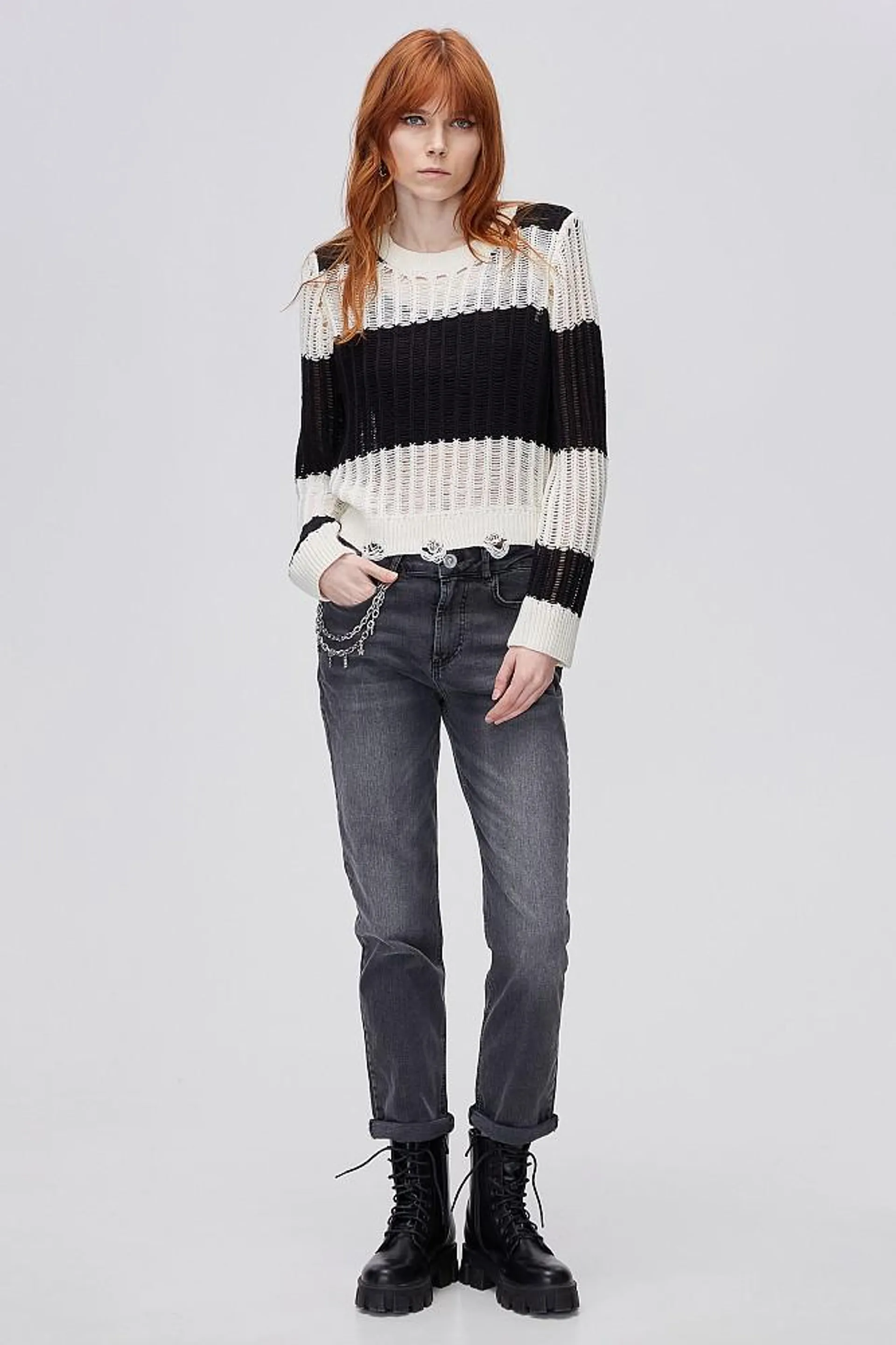 Knit sweater with loose knit