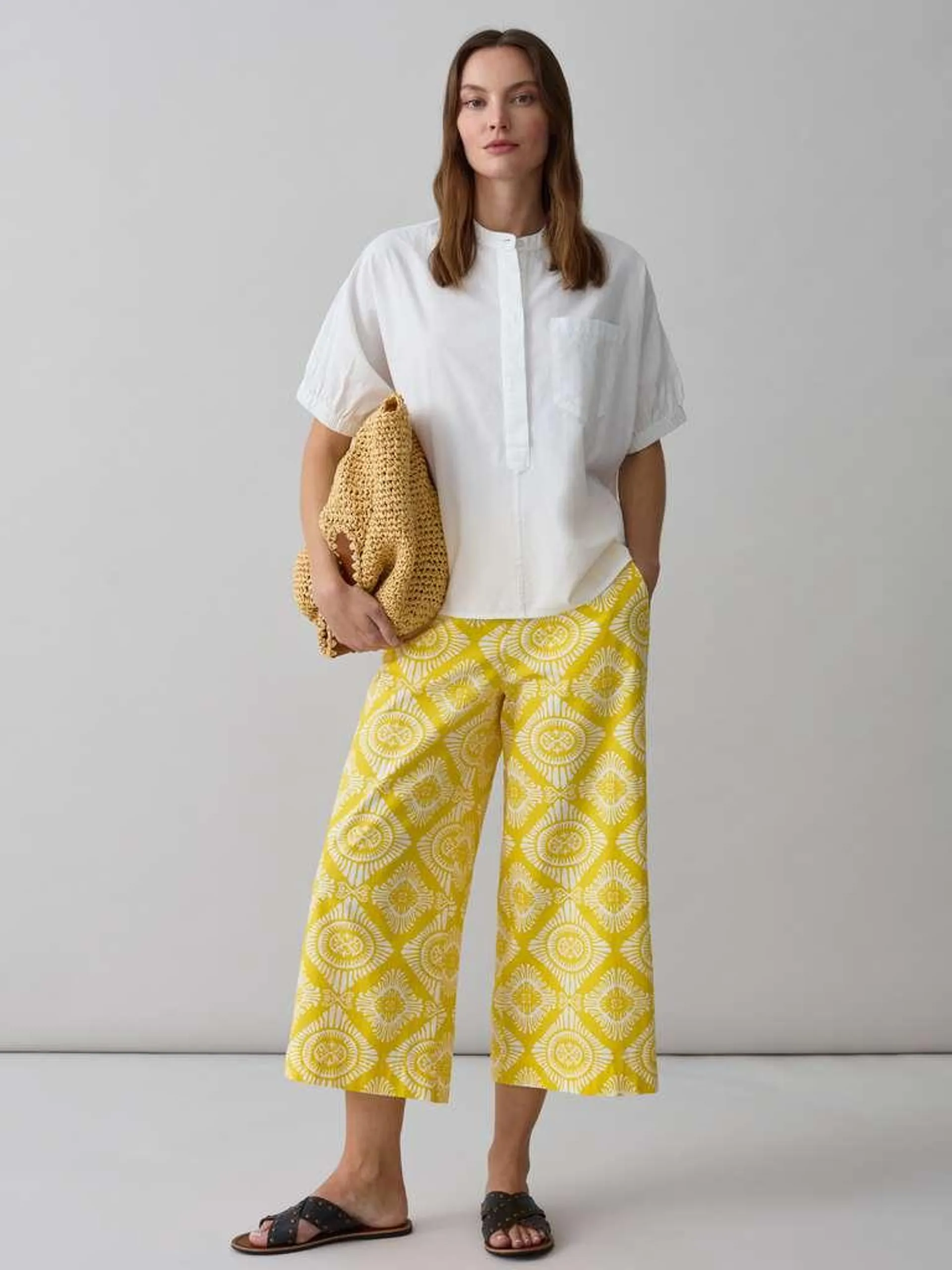 White/Yellow Wide-leg trousers with ethnic pattern