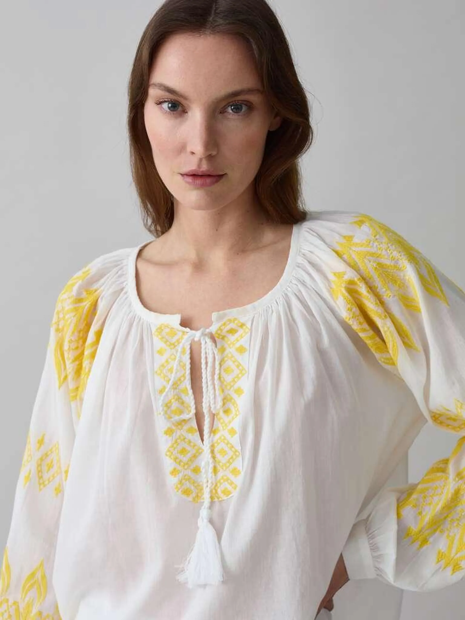 White/Yellow Oversized blouse with ethnic embroidery and tassels