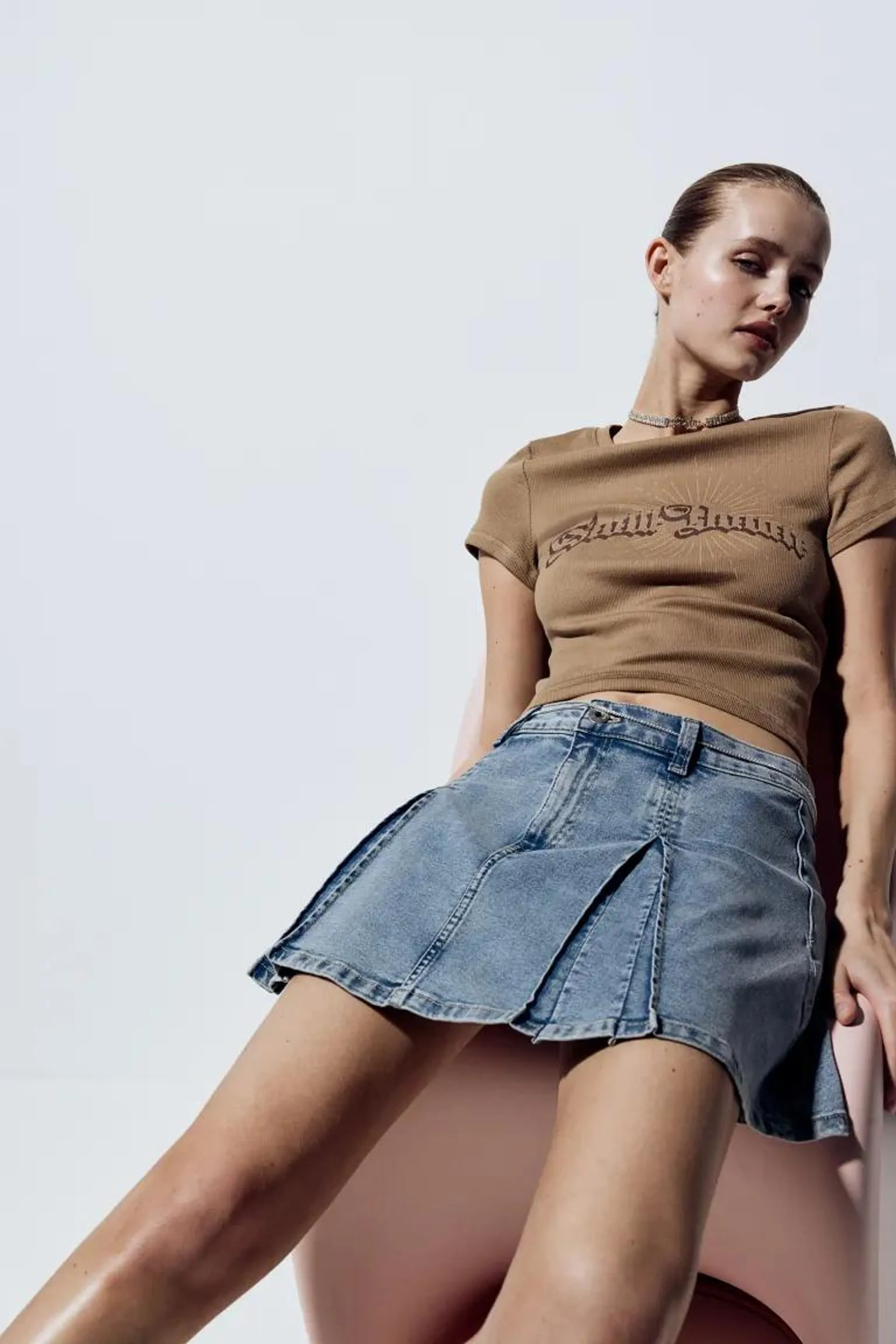 Pleated denim mini skirt