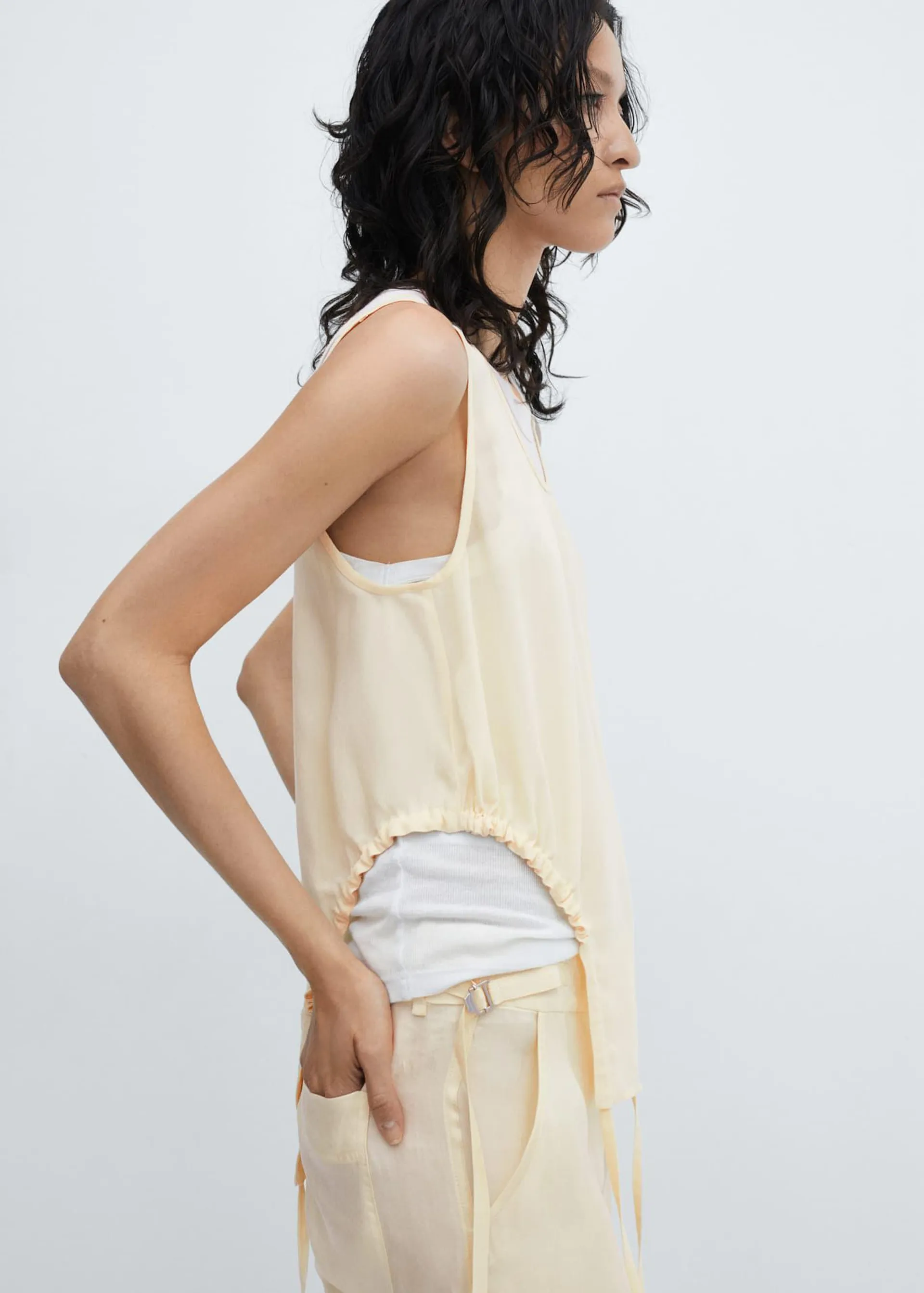 Semitransparent top with side pleats