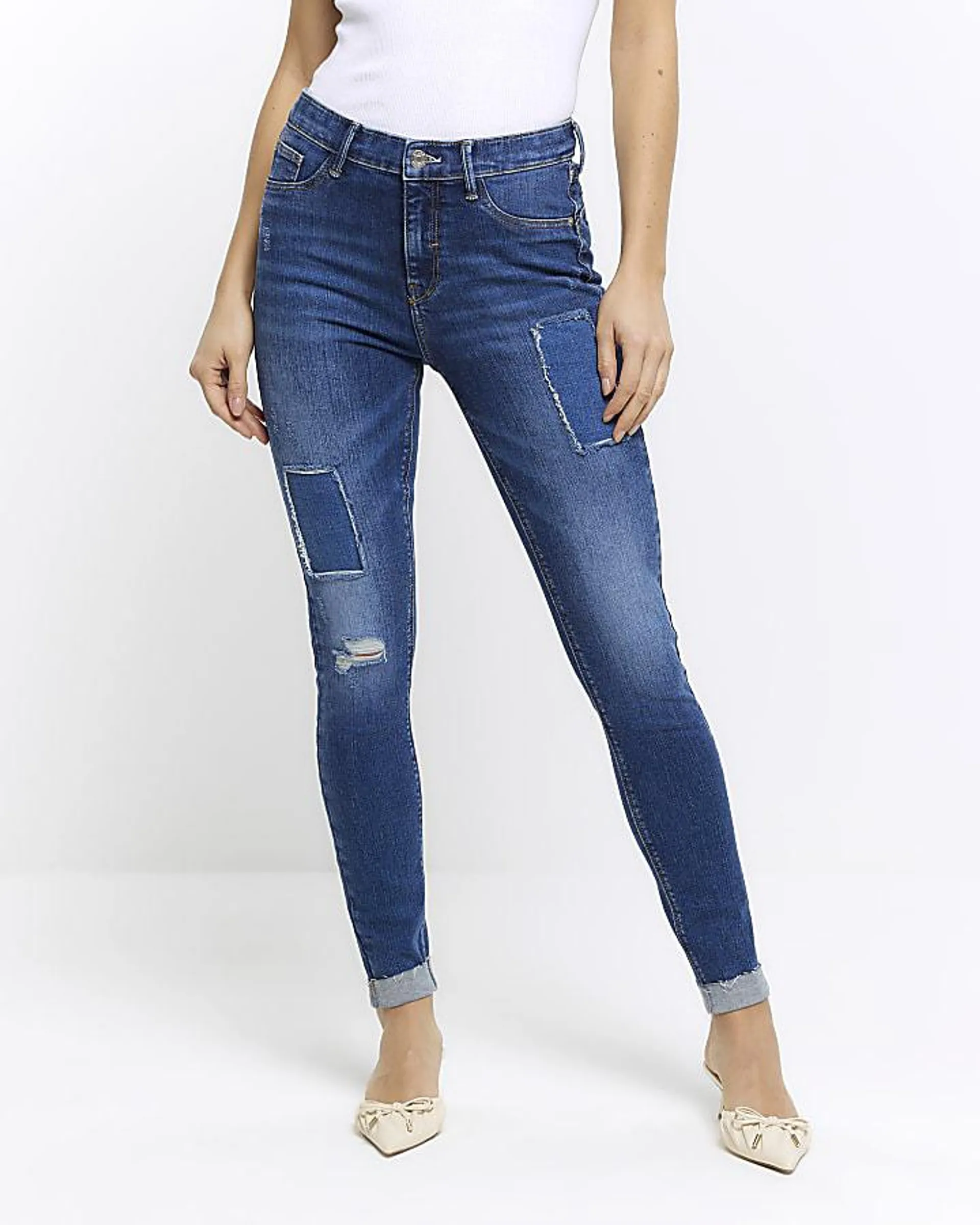 Blue mid rise bum sculpt patch skinny jeans