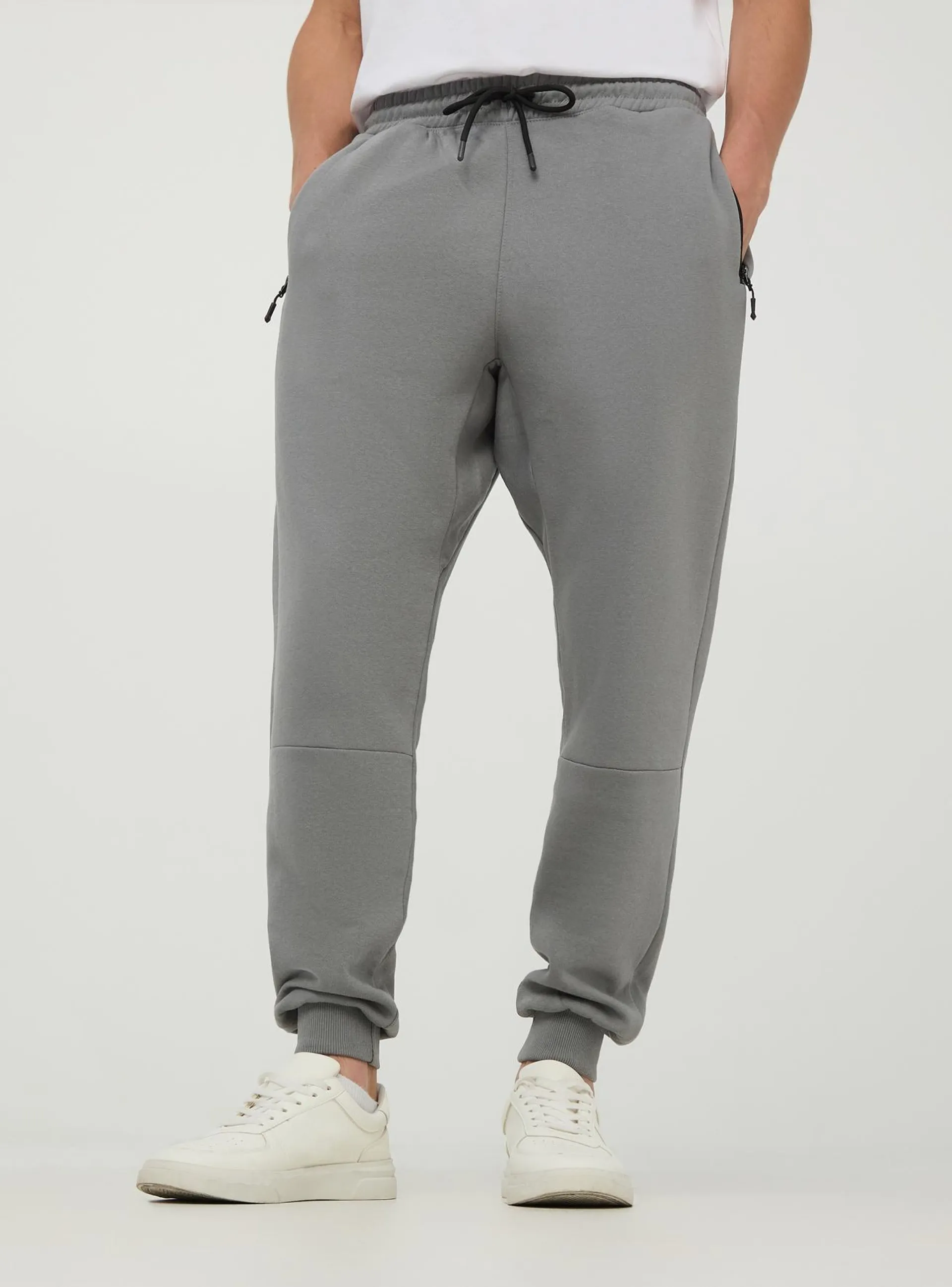 Pantaloni tuta tessuto tecnico con tasche con zip Grigio piombo