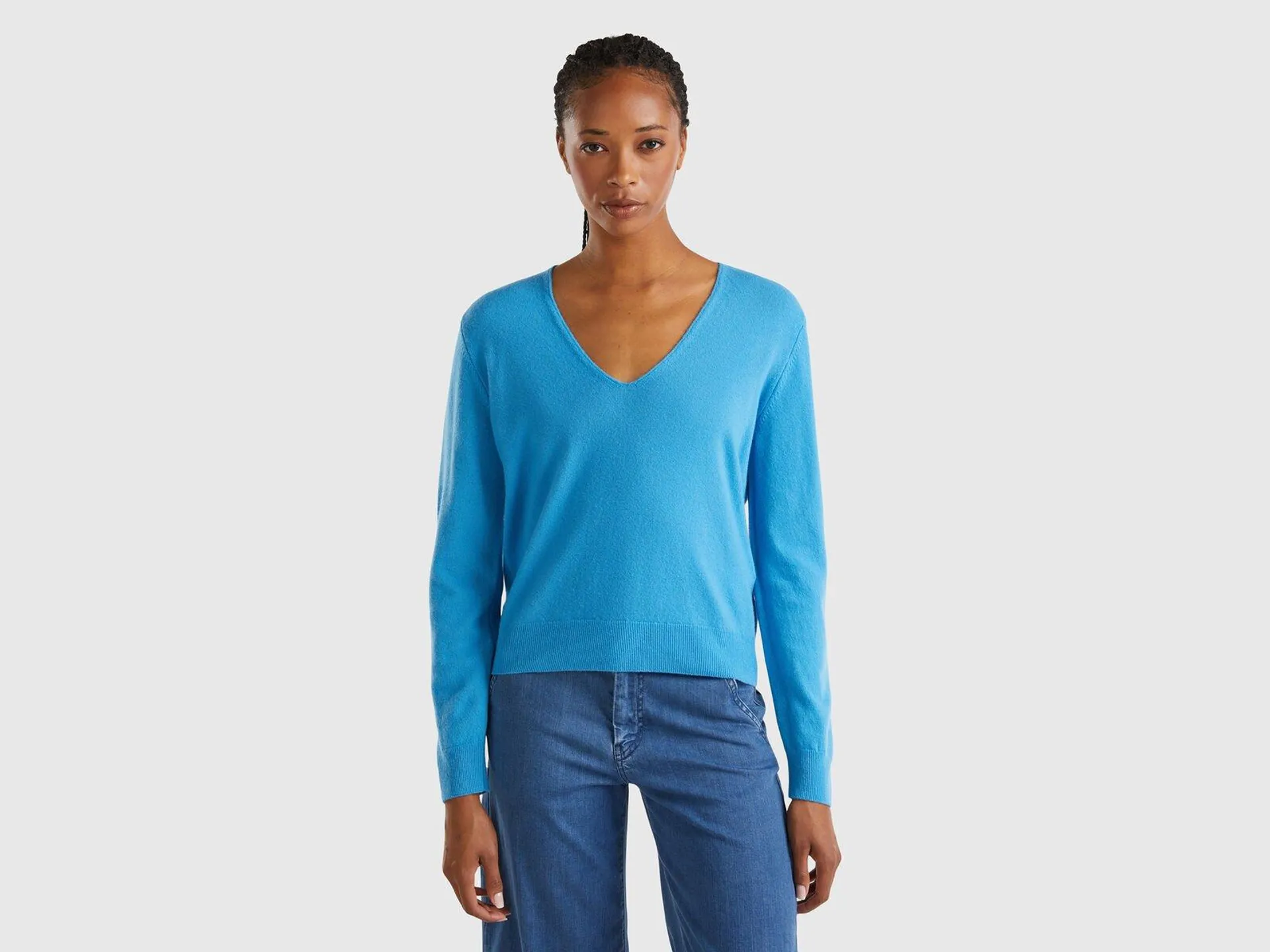 Maglione azzurro con scollo a V in pura lana Merino