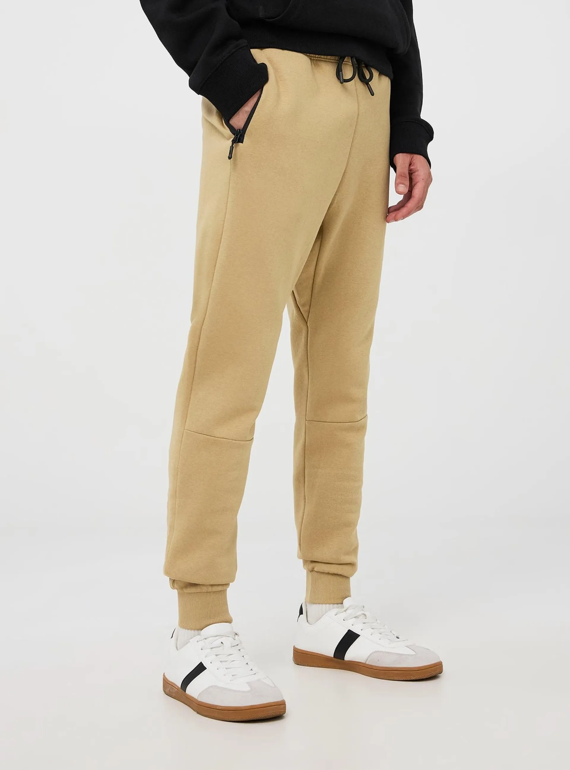 Pantaloni tuta tessuto tecnico con tasche con zip Beige chiaro