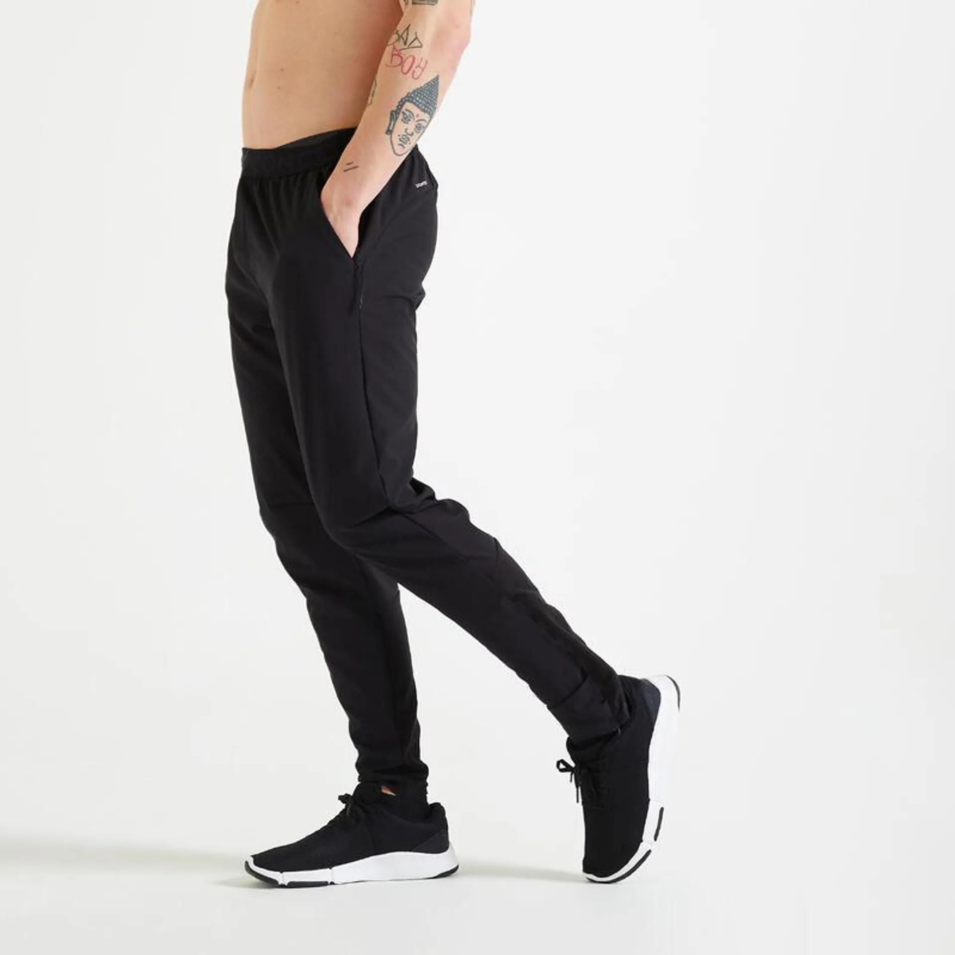 Pantaloni uomo fitness 900 zip alla caviglia neri