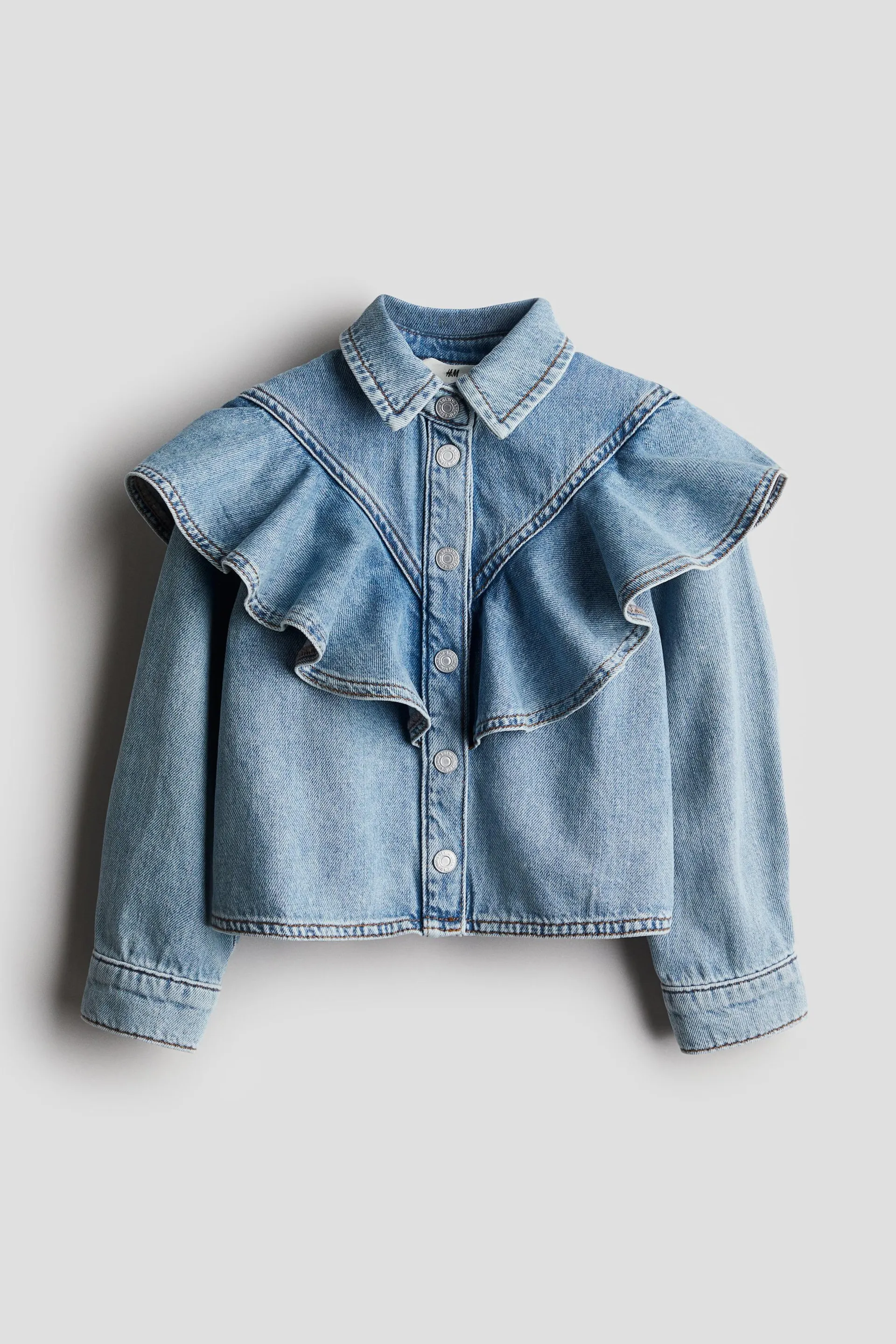 Blusa de denim con olanes