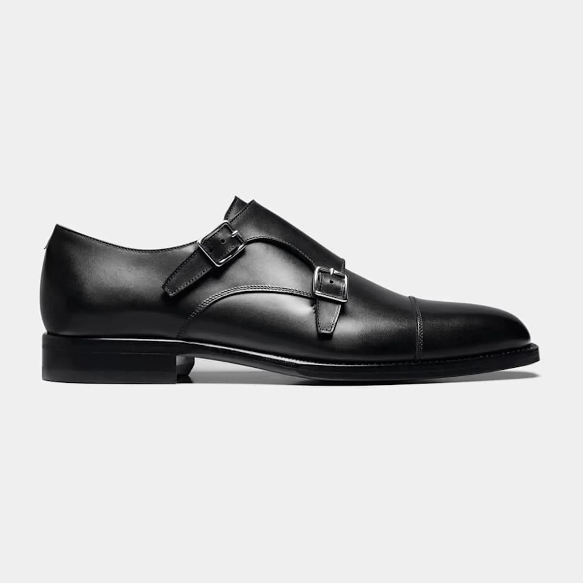 Made in Italy from supple Italian calf leather, these elegant black monk straps feature full leather lining and sole, and are constructed in a Blake stitch.