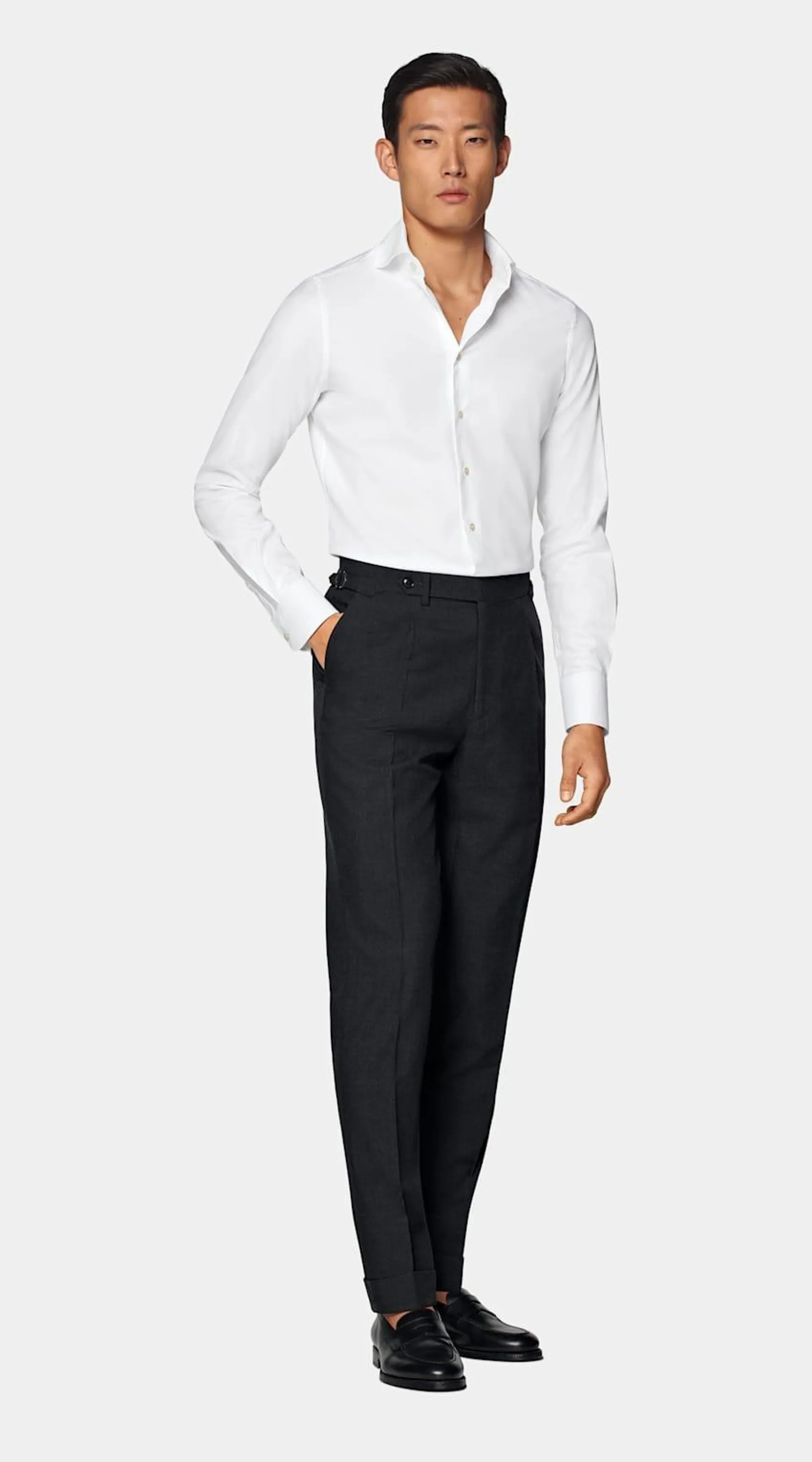 This crisp white button-up is tailored fit and features a curved cutaway collar and single cuff.