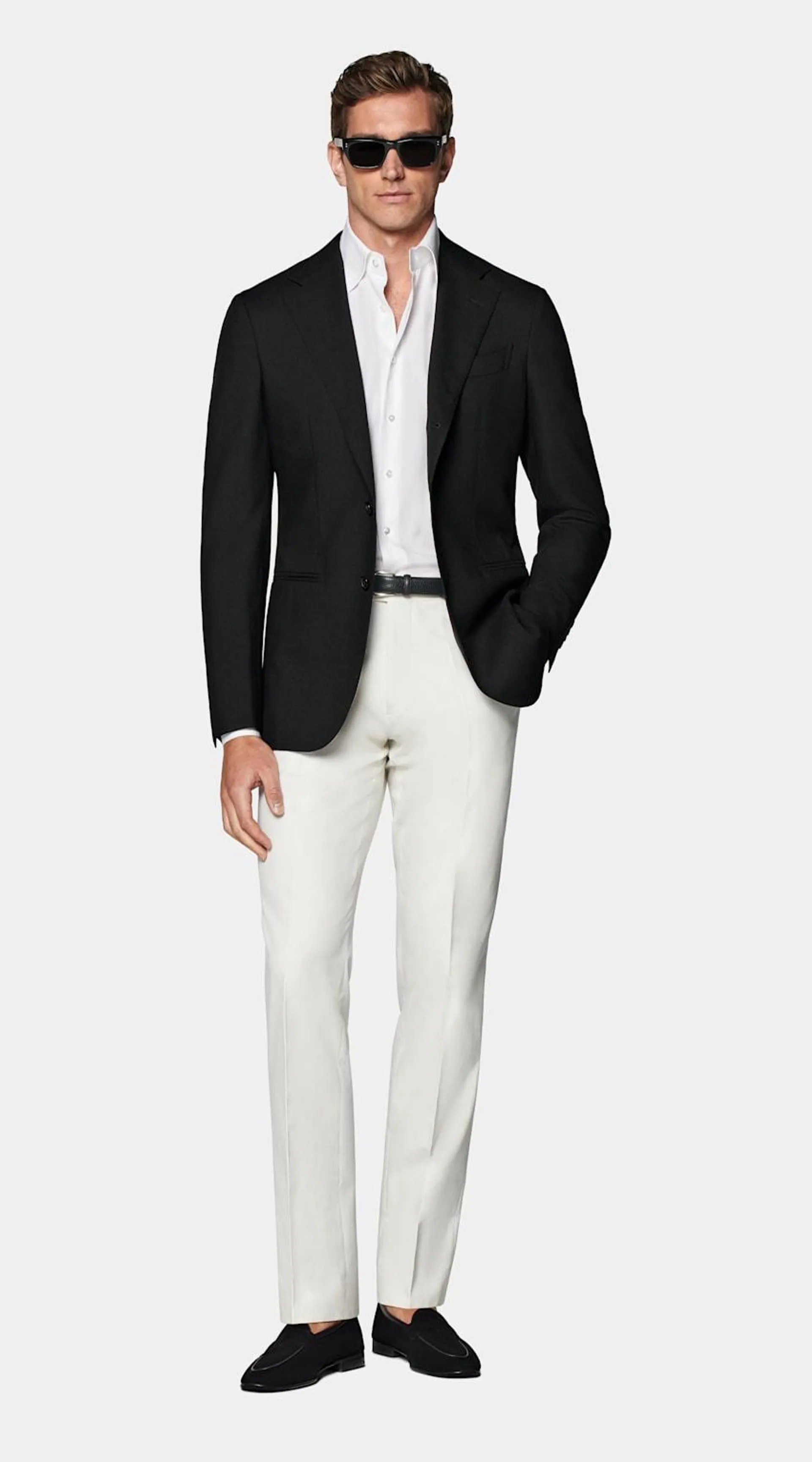 Available as a full suit or on its own, this unlined tailored blazer features a widened notch lapel, jetted pockets, and a natural unpadded shoulder.