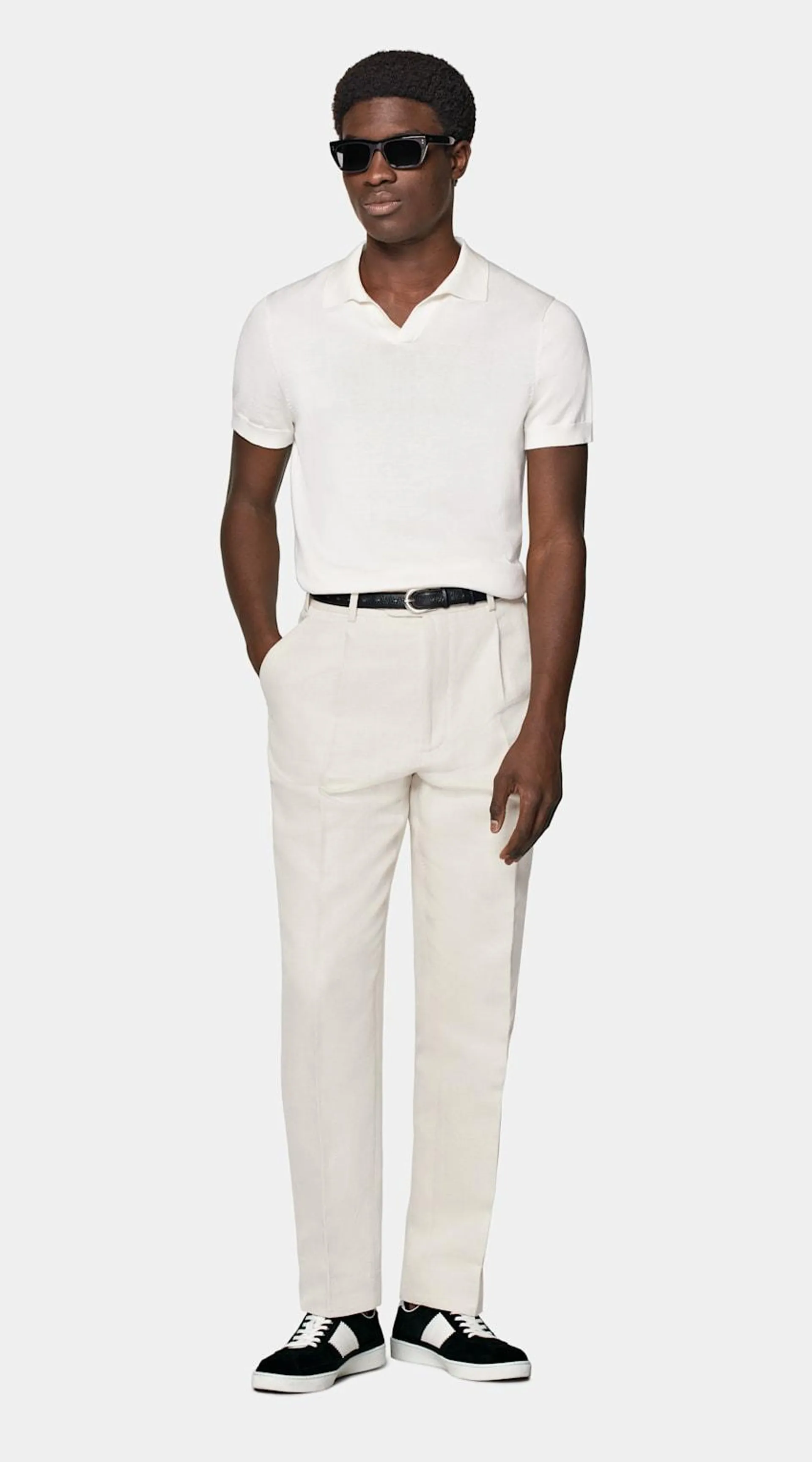 A comfortably tailored knit highlighted by a buttonless placket, this off-white polo brings all the versatility of the classic piece in a fresh new way.