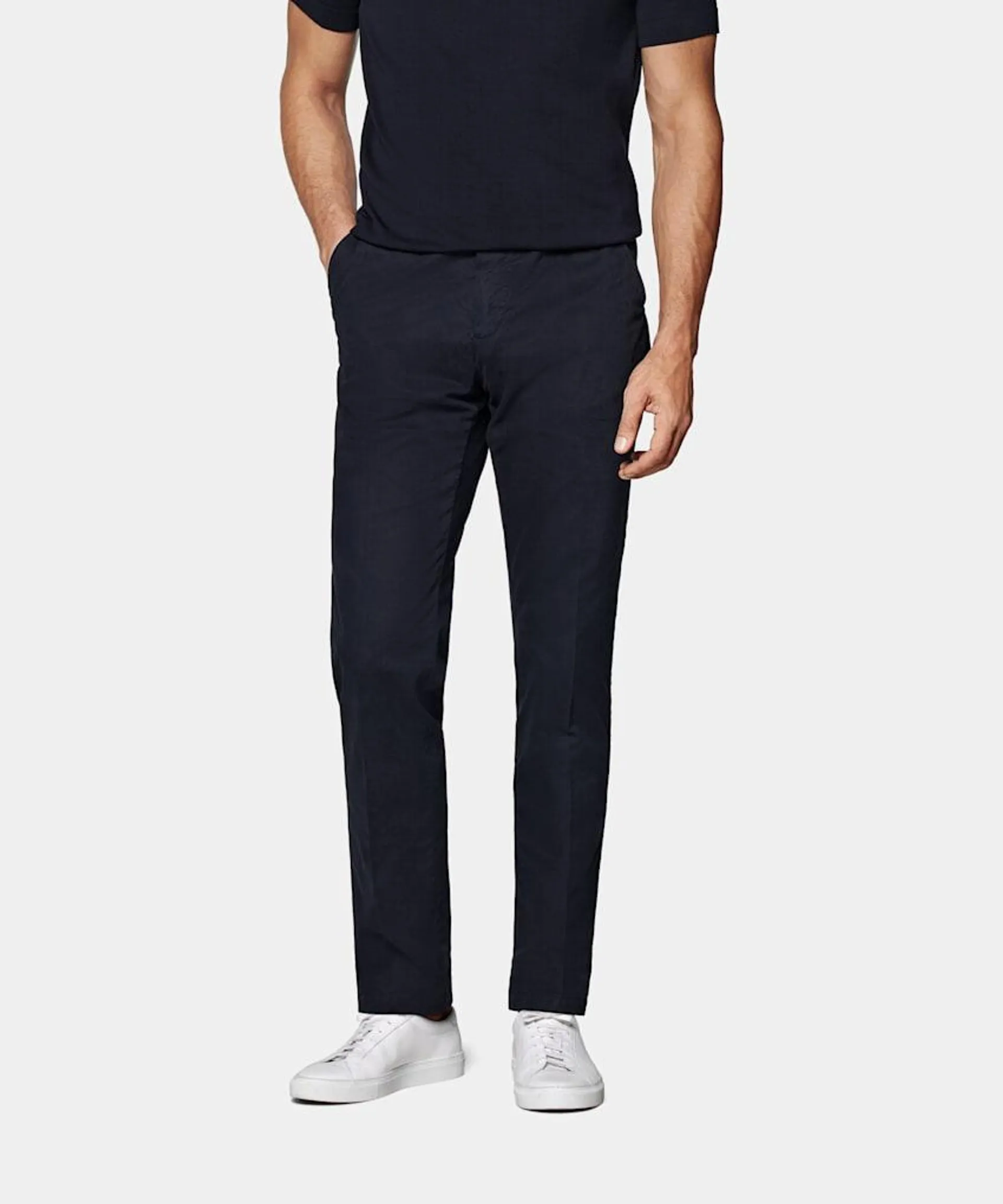 These navy chinos are cut slim through the hip and thigh, with a slim, straight lower leg, and feature belt loops and a flat-front finish.