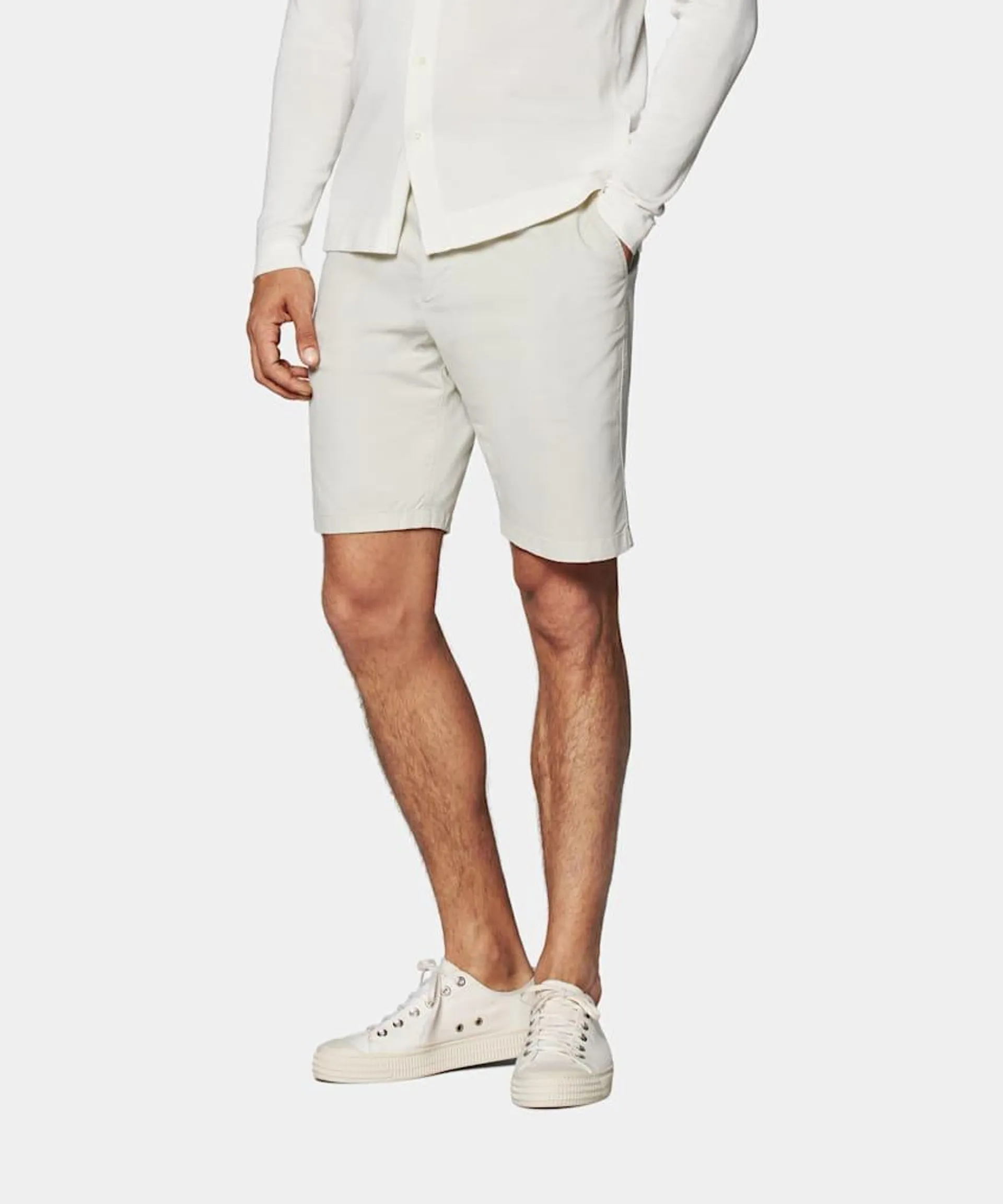 These sand shorts are tailored with a slim leg cut and include a flat front design along with belt loops