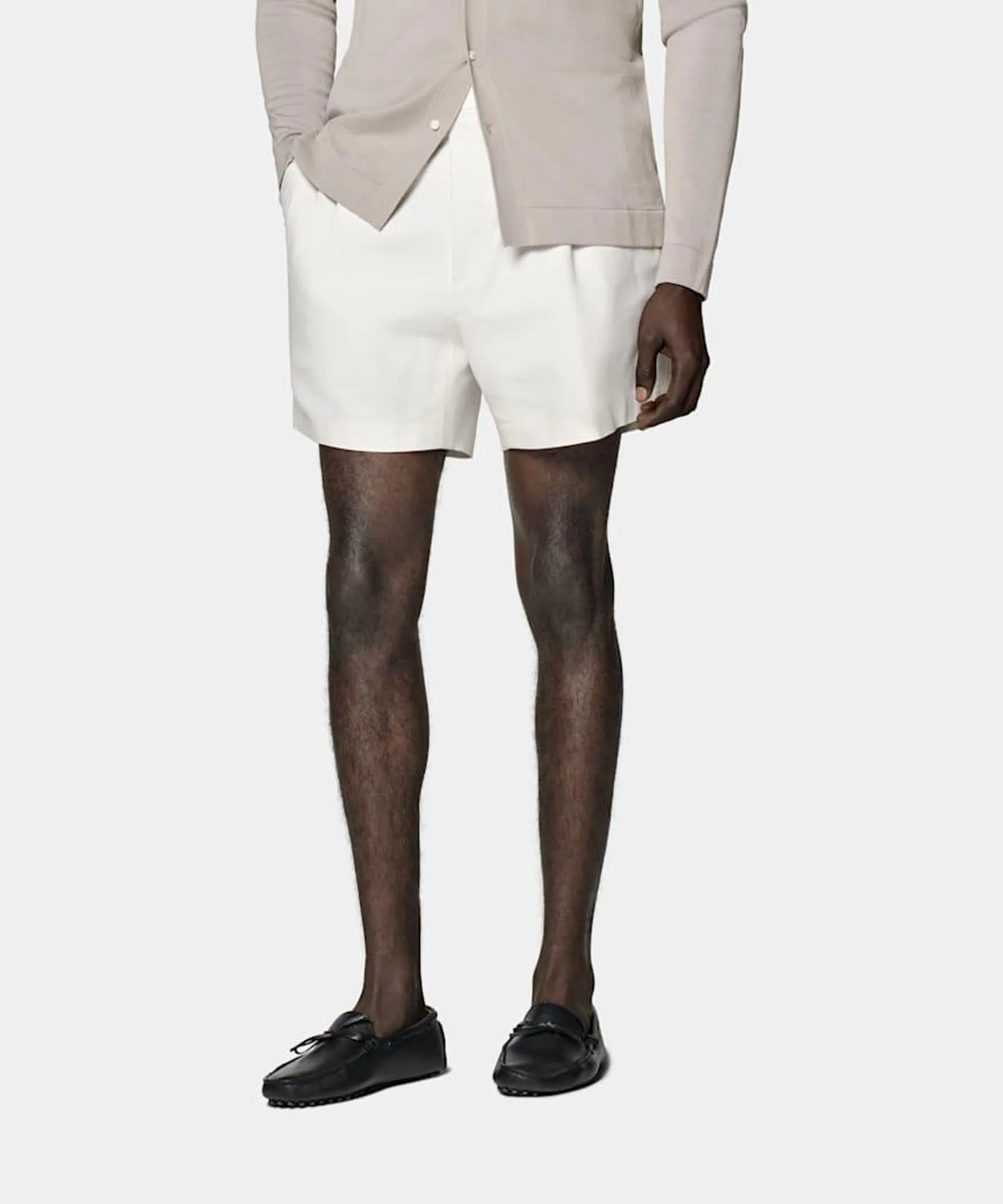 Cut to a mid-thigh length with a high-rise waist, these relaxed fit white Duca shorts feature a single pleat and side adjusters for an elevated comfortable summery vibe.