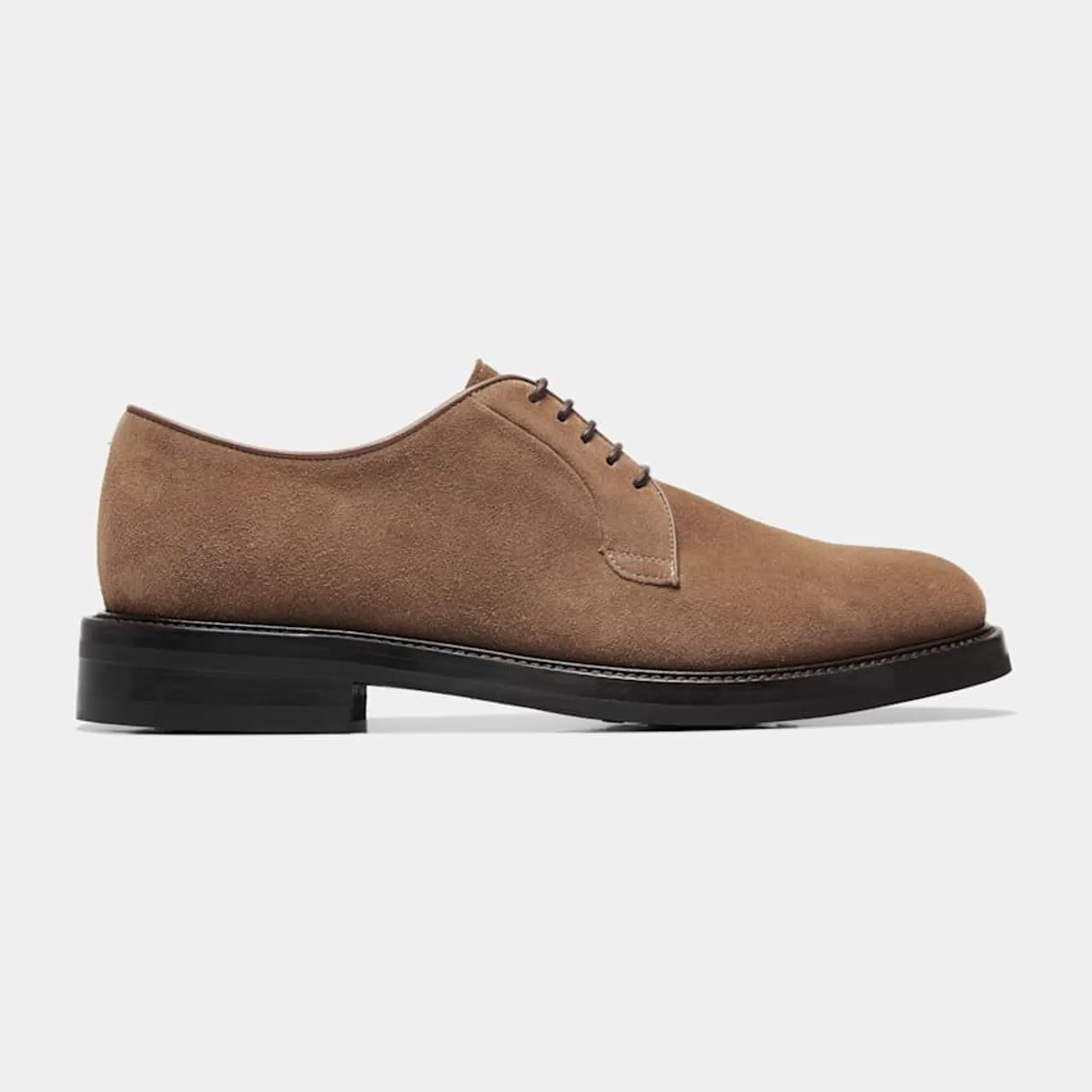 These contemporary light brown Derby lace-ups are crafted in Italy from supple Italian calf suede and feature full leather lining and a Vibram sole.