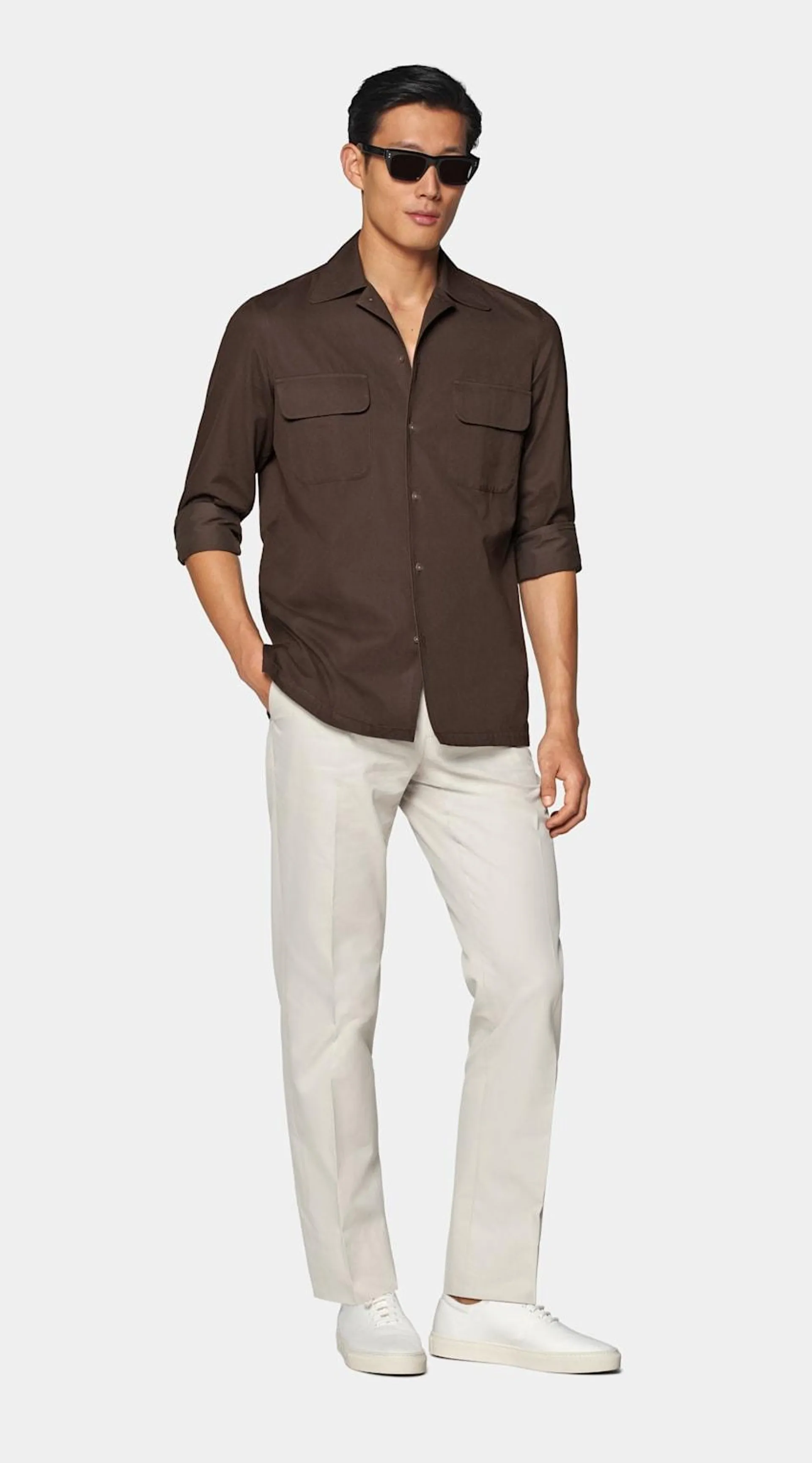 Explore understated sophistication with this mid brown casual shirt, featuring single cuffs, a relaxed yet tailored cut, and a sleek French placket.