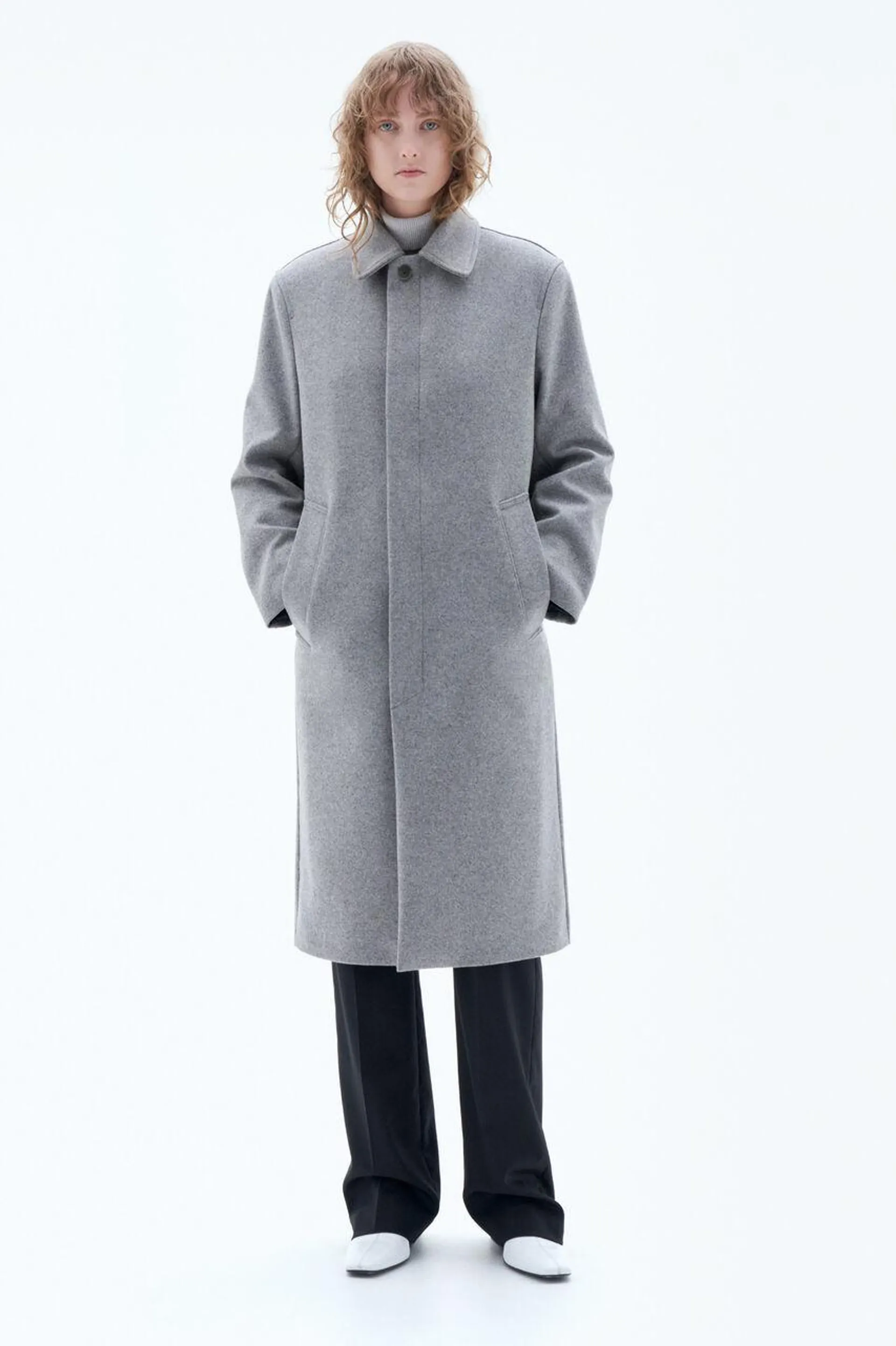 Single-breasted car coat in compact yet light Italian wool with a felted look. Layer over high-neck knitwear for a classic look.