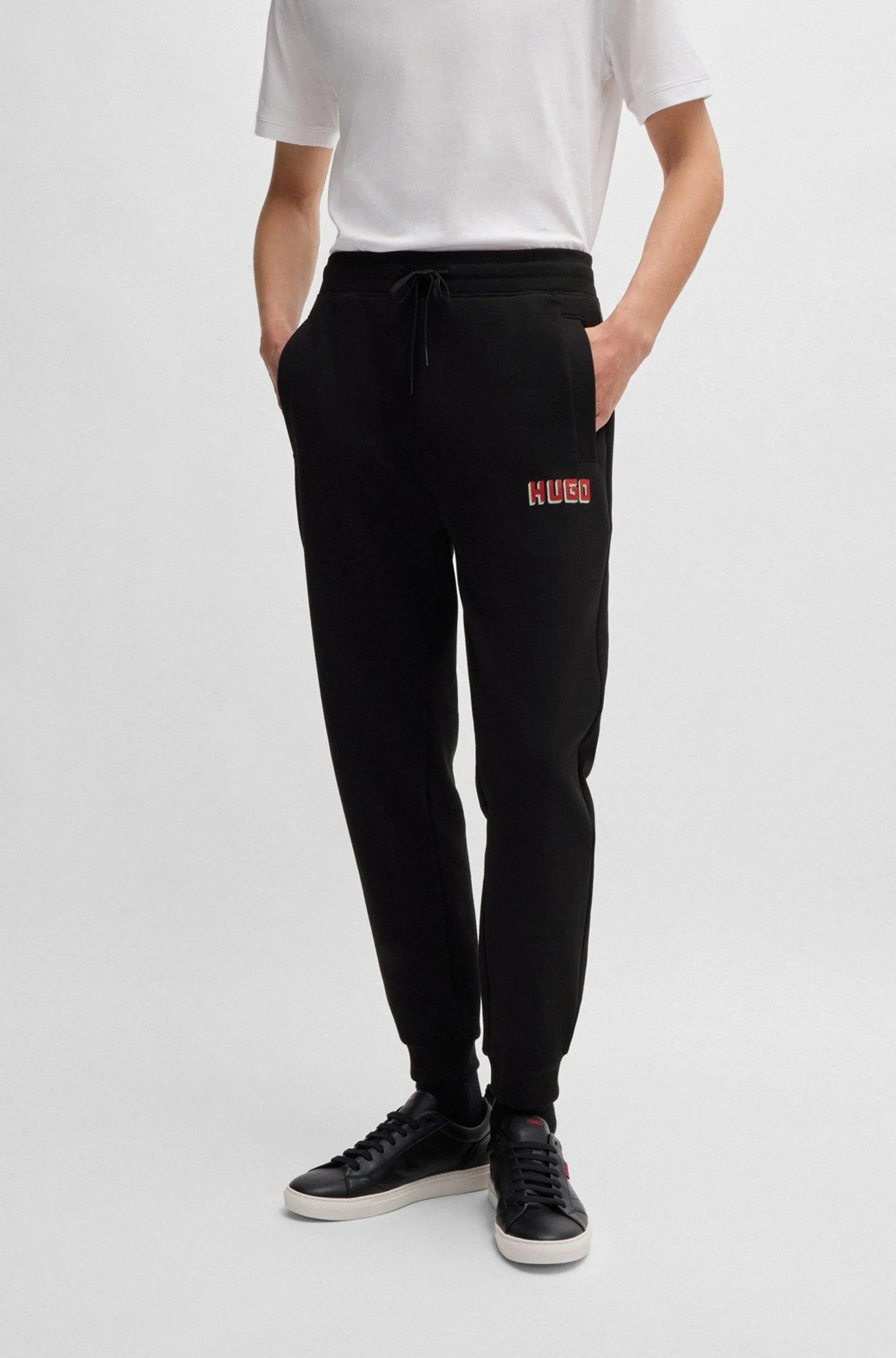 Cotton-terry tracksuit bottoms with logo print