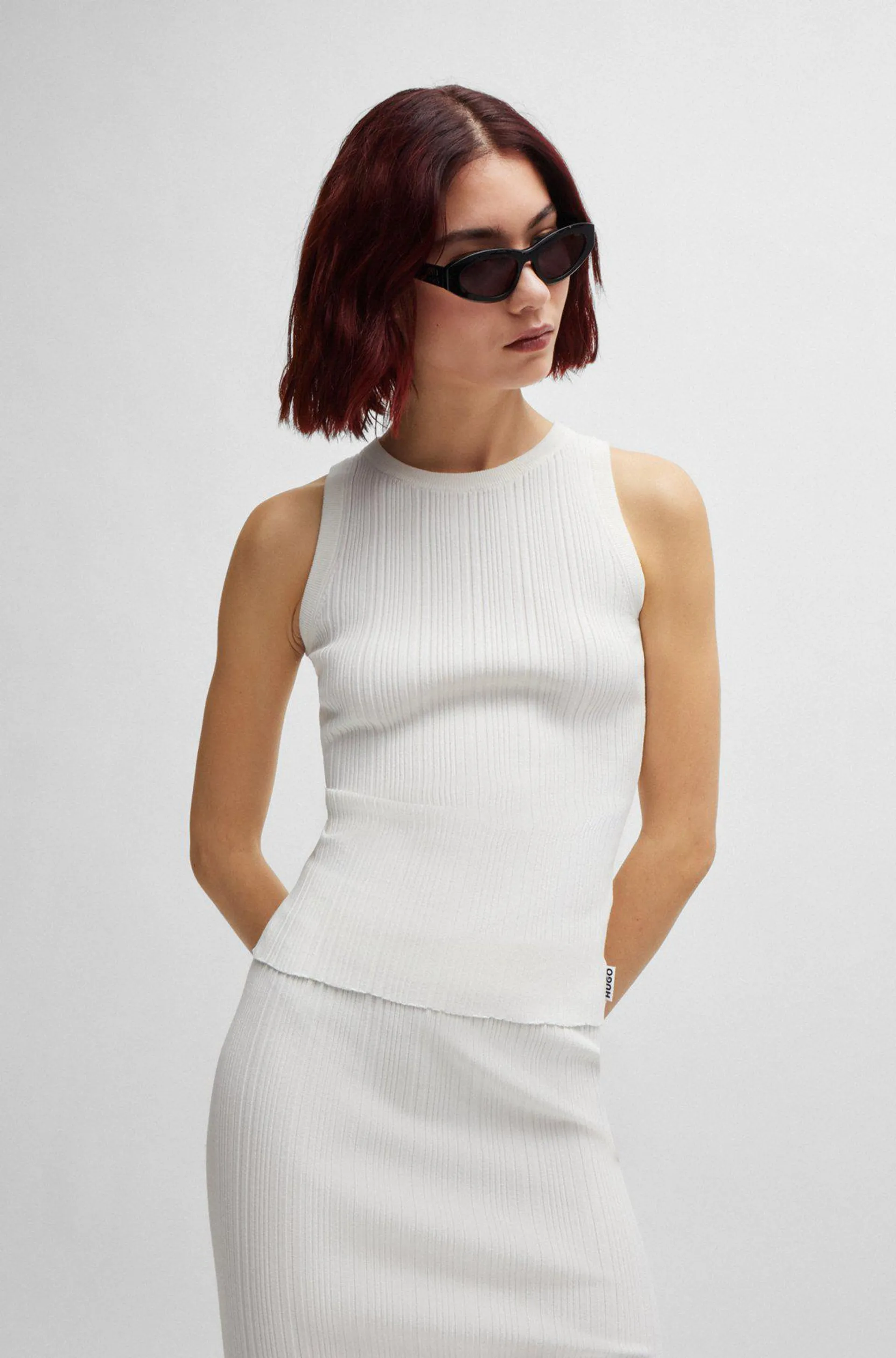 Slim-fit sleeveless top with irregular ribbed structure