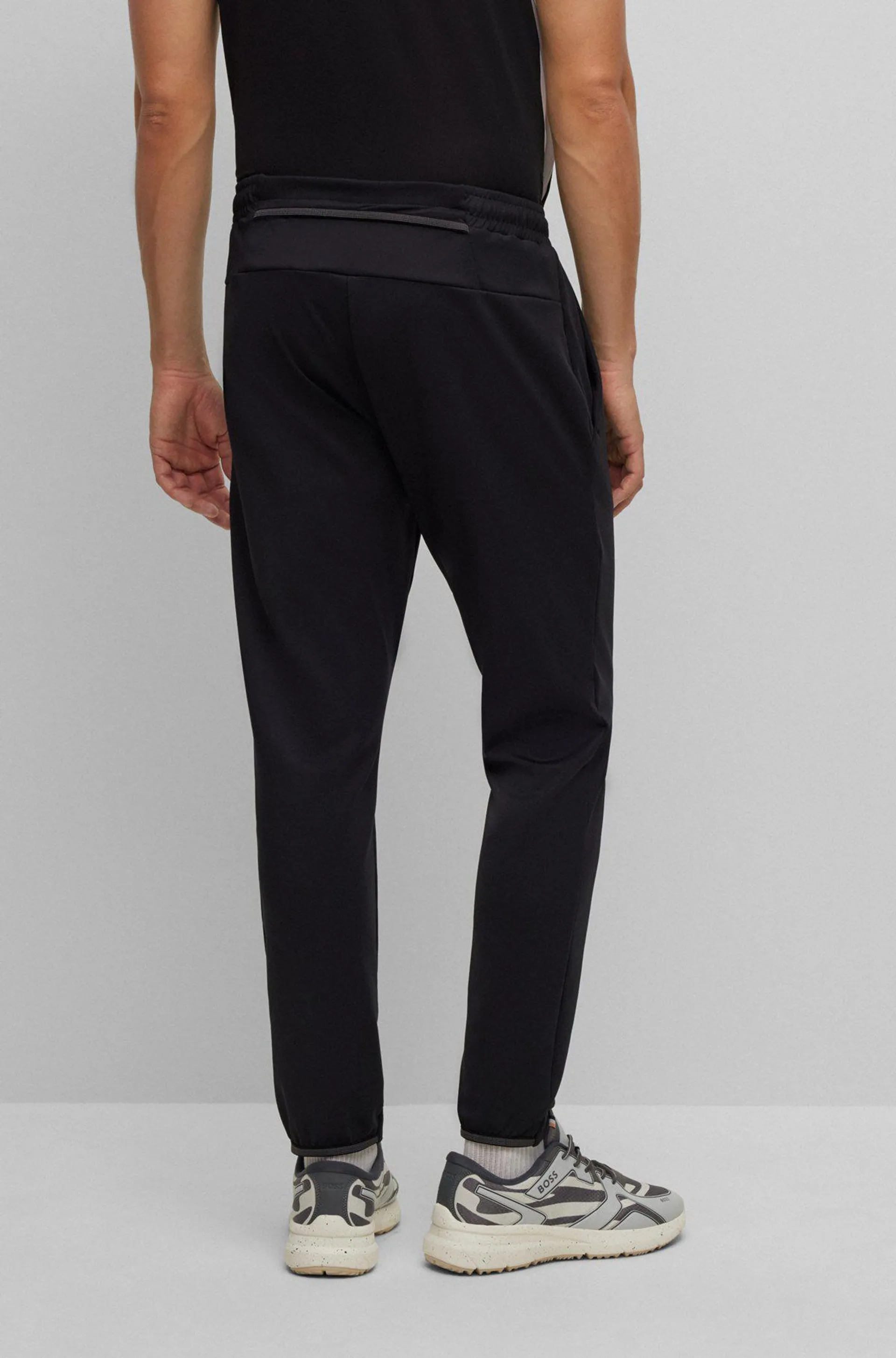 Cuffed tracksuit bottoms in active-stretch fabric
