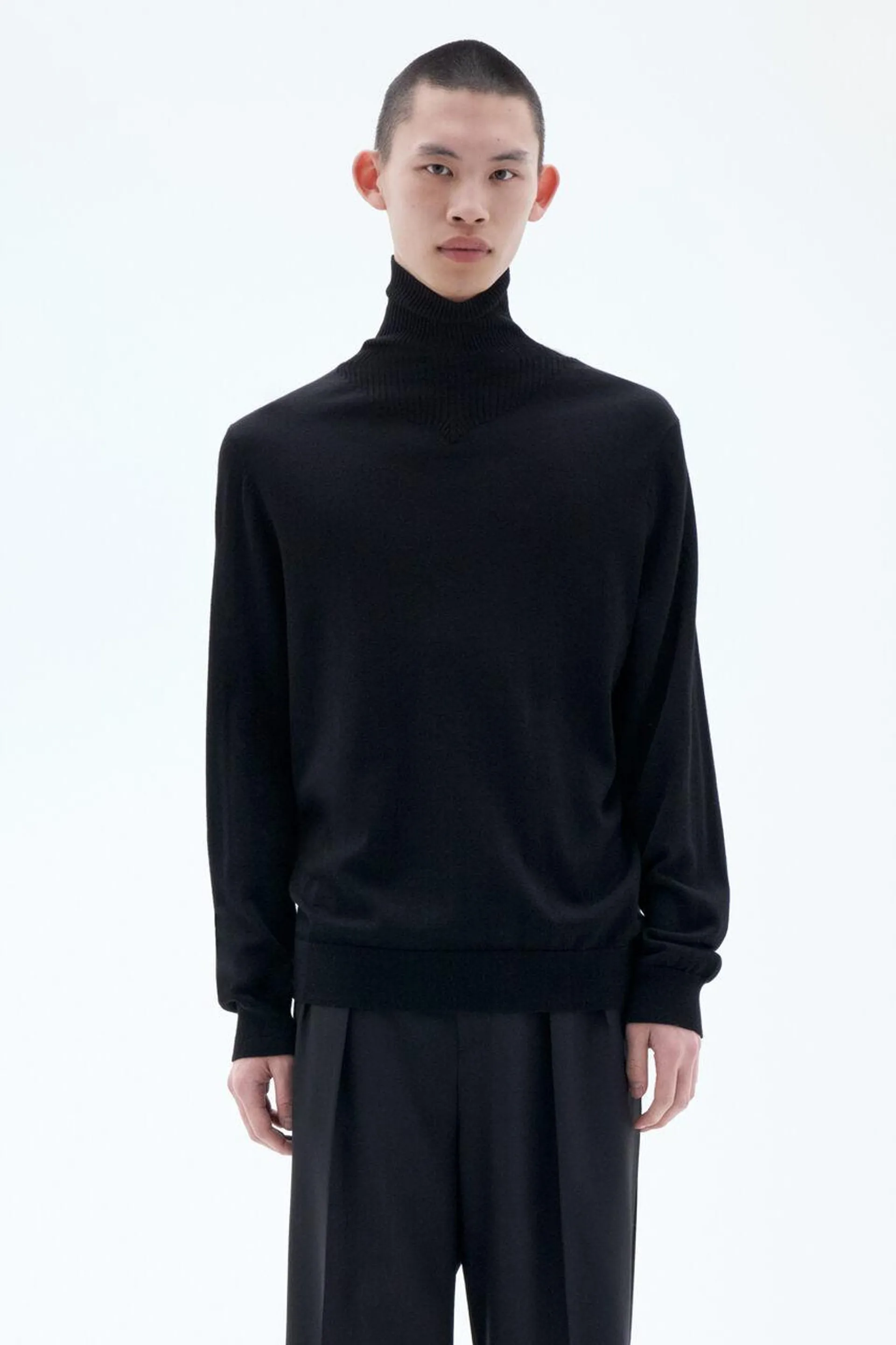 Lightweight turtleneck sweater knit from certified merino wool.