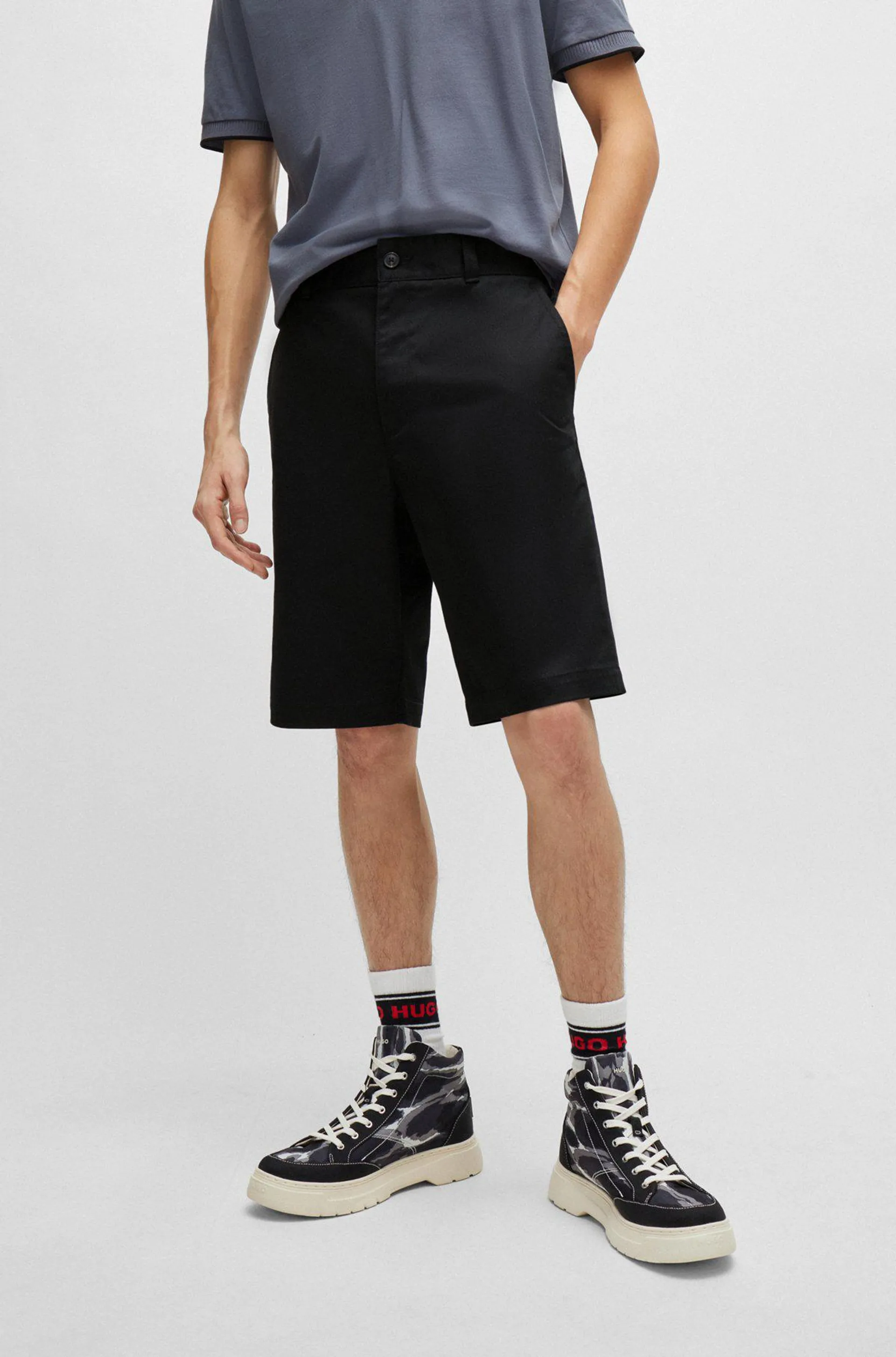 Regular-fit shorts with slim leg and buttoned pockets