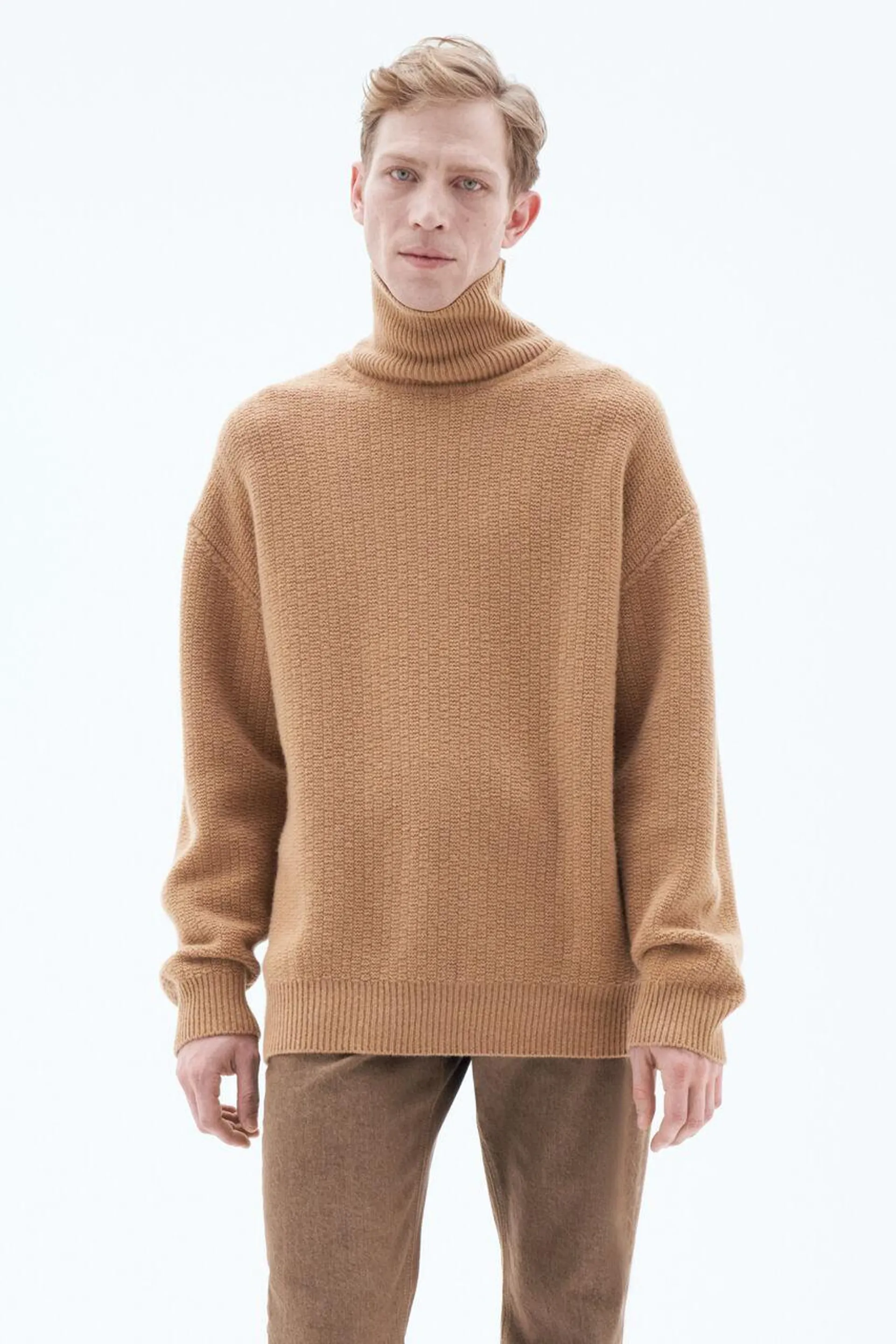 Oversized turtleneck sweater in recycled Italian wool with a structured knit pattern.