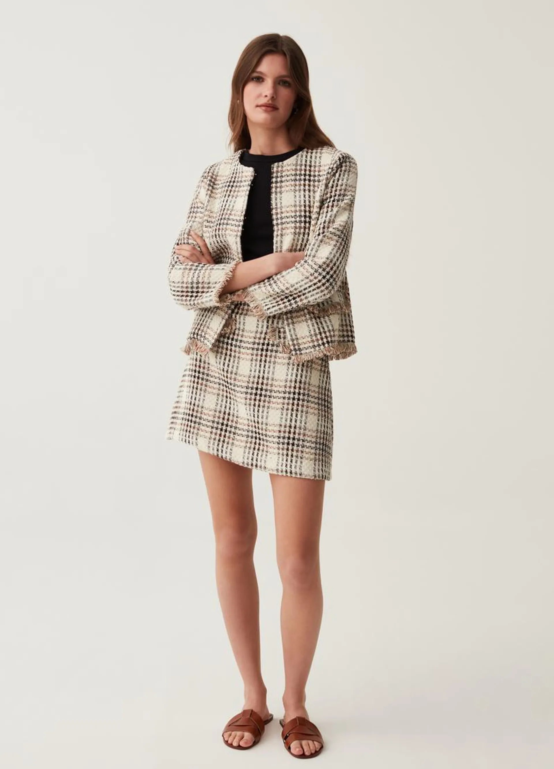Tweed-effect miniskirt with check pattern.