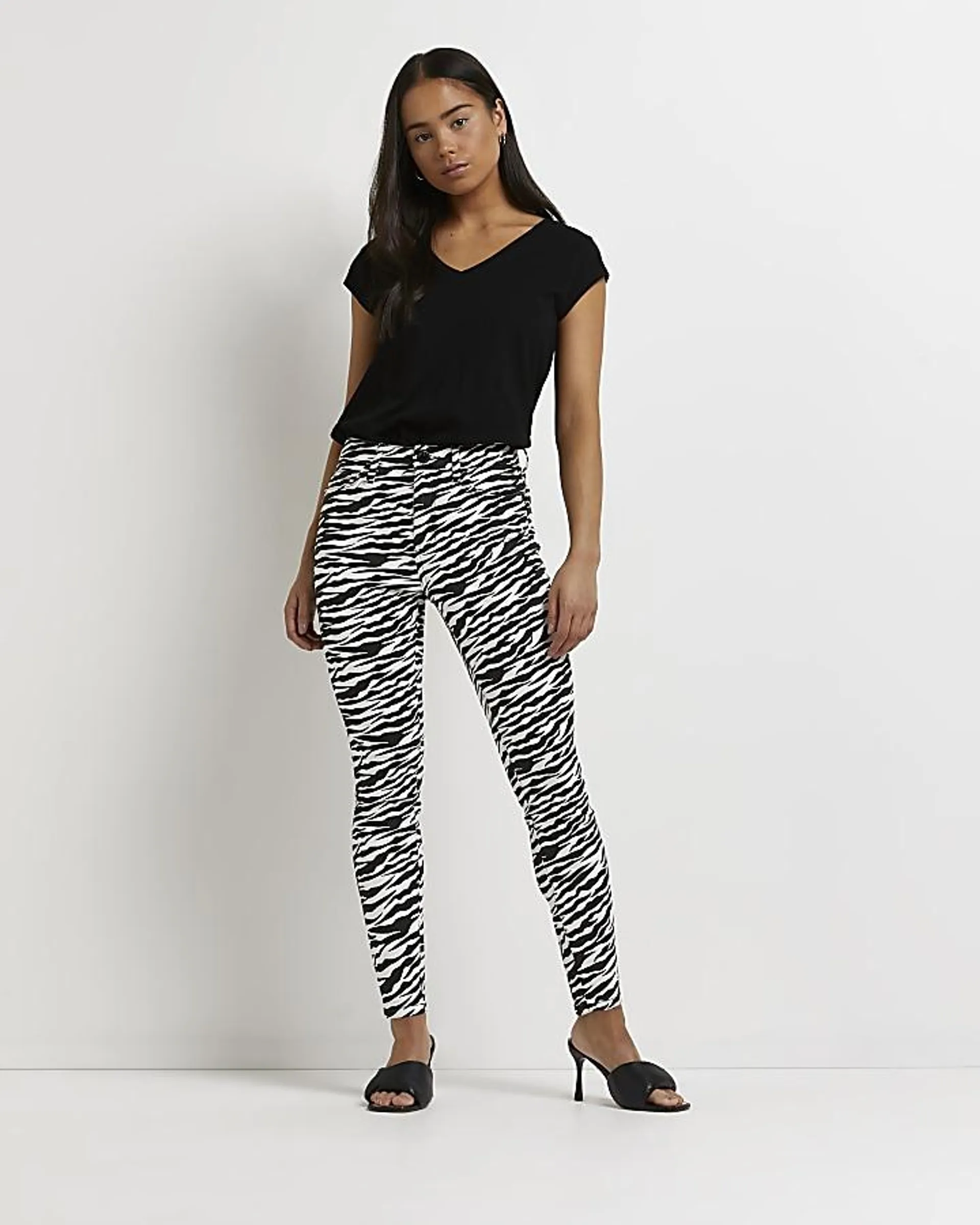 Petite black zebra bum sculpt skinny jeans