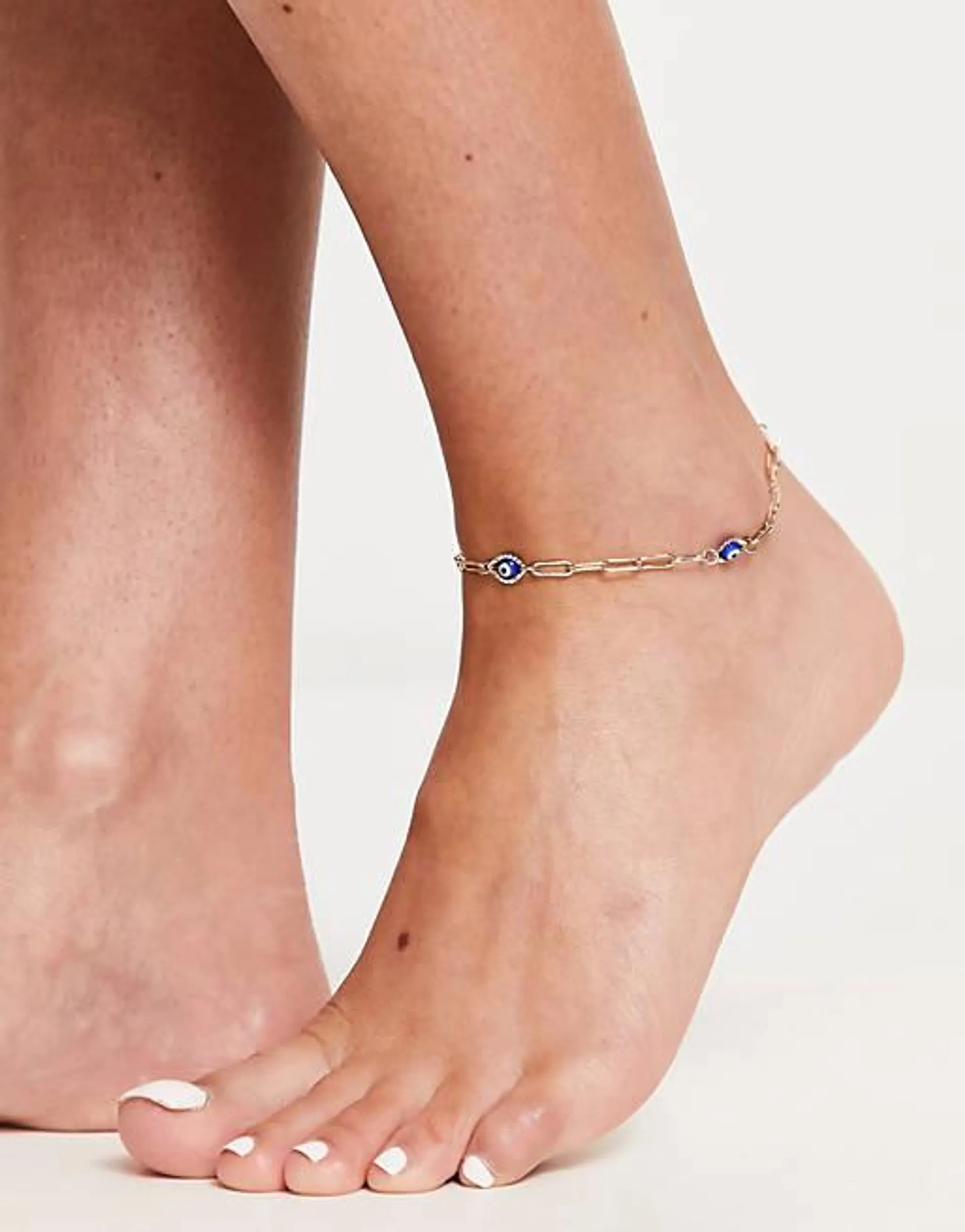 ASOS DESIGN anklet with blue eye charms in gold tone