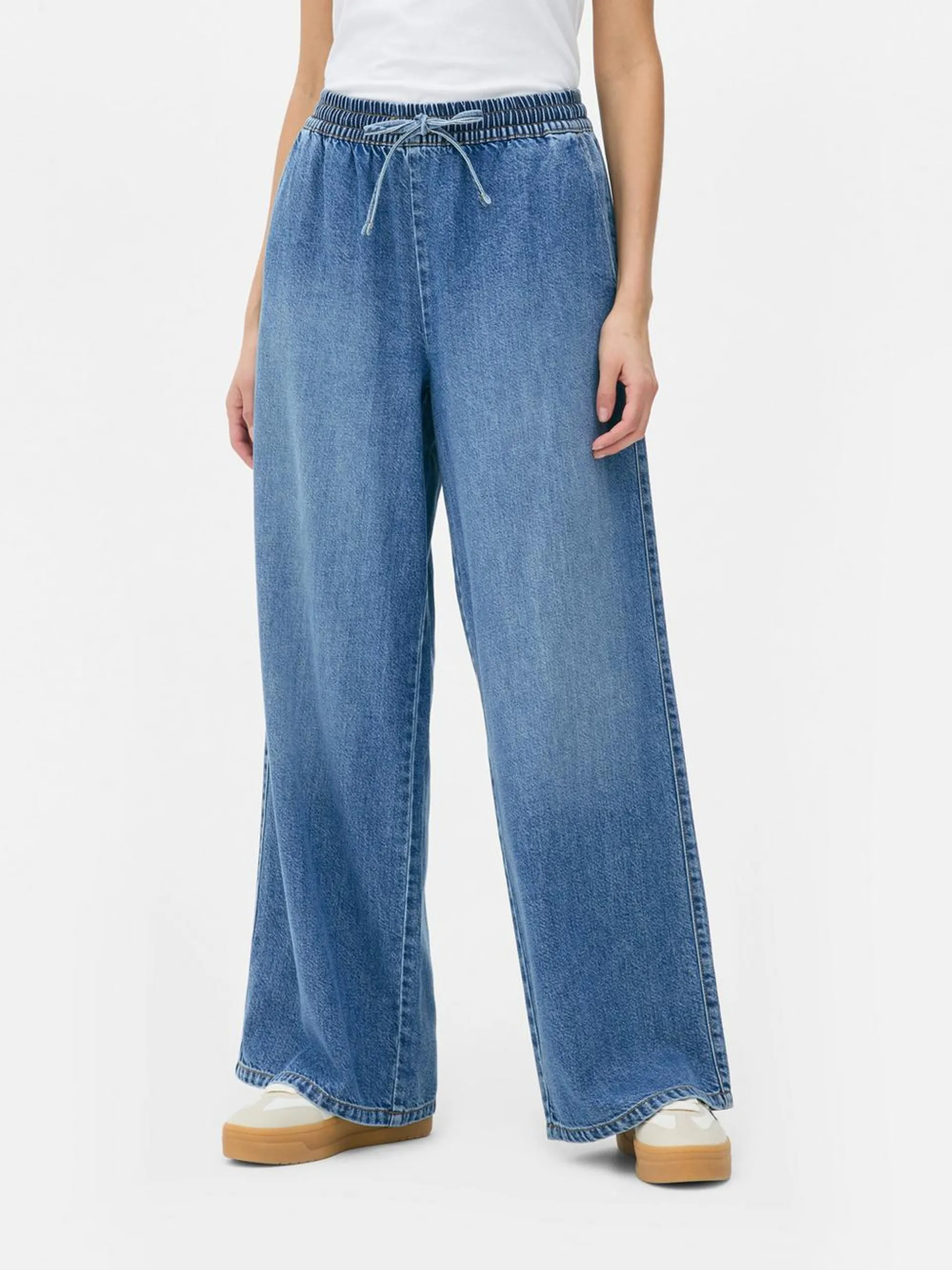 Pantaloni tuta jeans a gamba larga