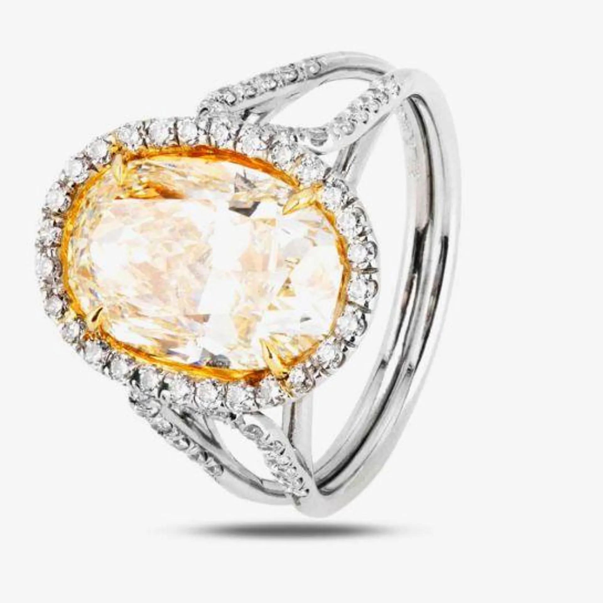 Platinum 5.03ct Yellow Diamond Oval Cluster Ring