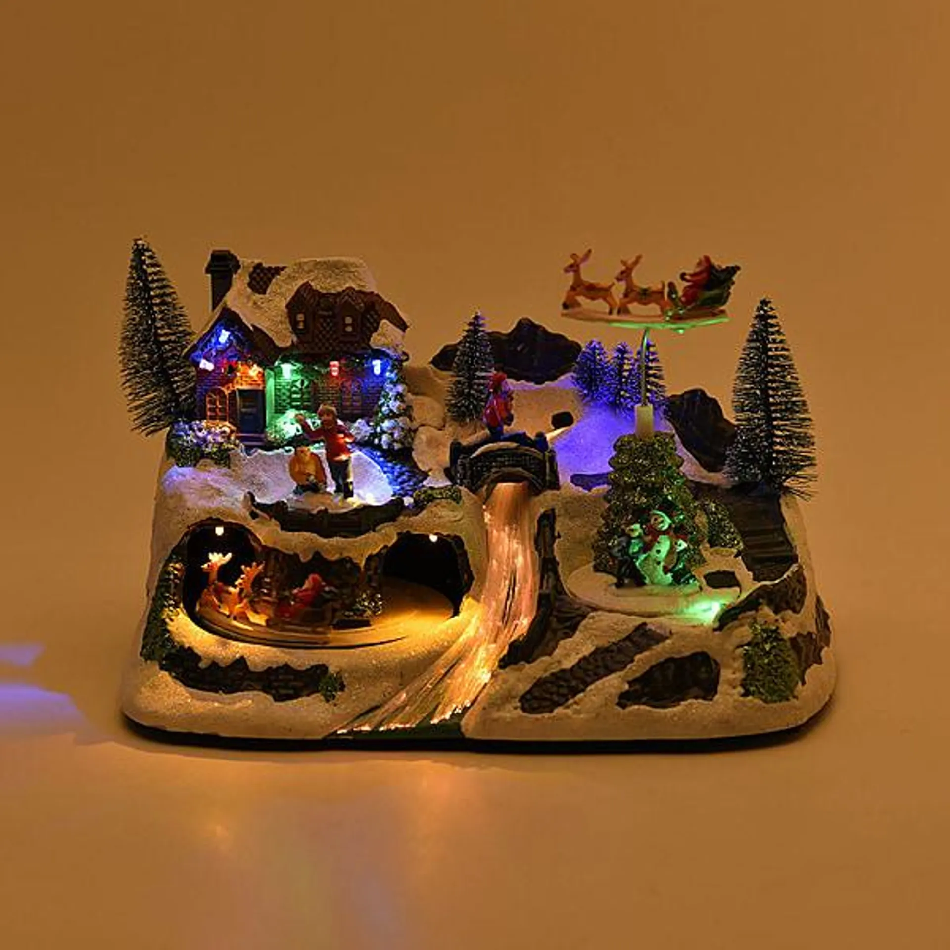 Christmas LED Village with Flying Sleigh & Music (Size 30x20x20 Cm) 3 x AA batteries not included