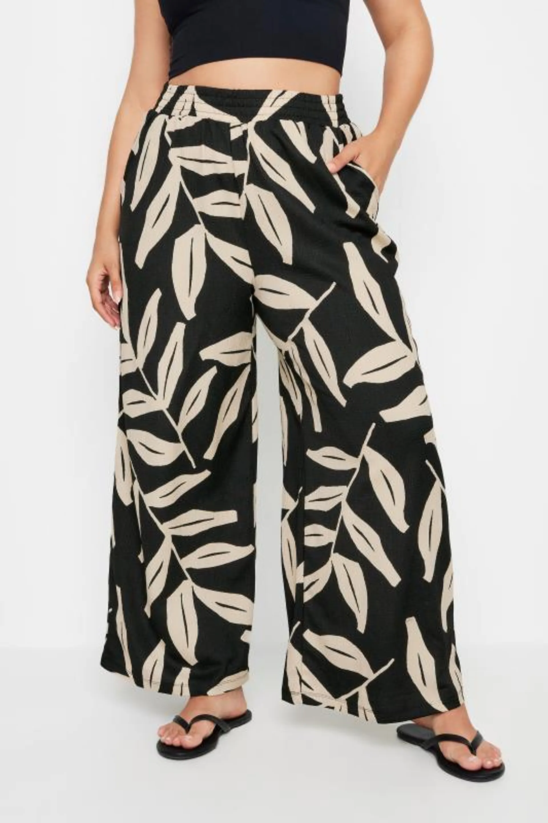 YOURS Curve Black Leaf Print Crinkle Trousers